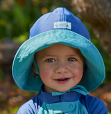 baby in UPF travel clothing