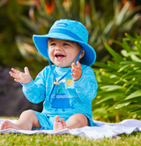 Baby in UV Skinz's UPF clothing