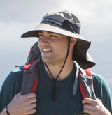 man hiking in a UPF hat and shirt