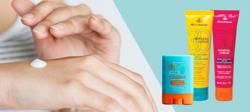 woman putting sunscreen on