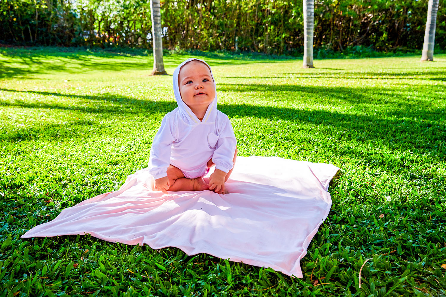 Baby on UV Skinz's UPF baby sun blanket