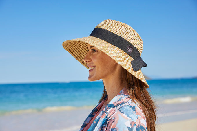 Woman wearing a sun hat that fits her face shape