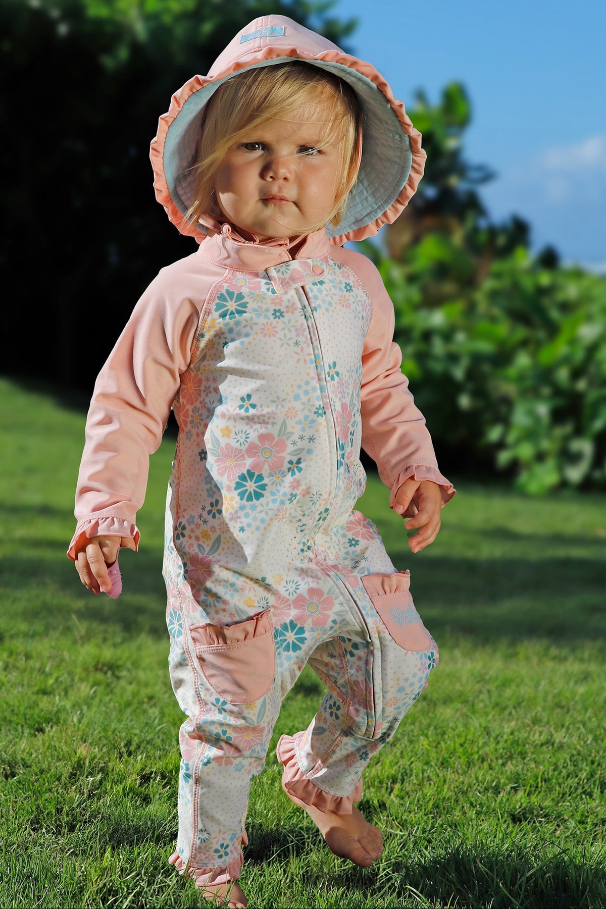 baby girl running in one piece sun & swim suit secret garden