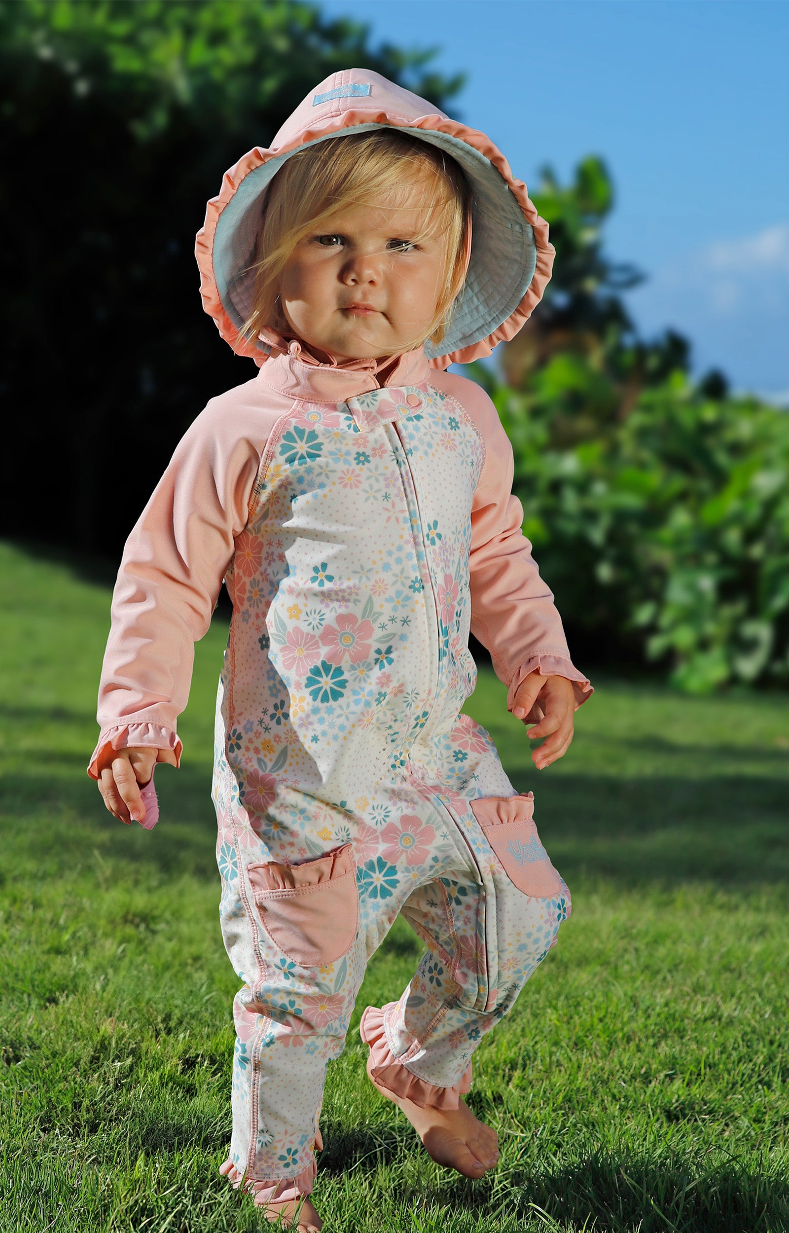 baby girl running in one piece sun & swim suit in secret garden|springtime-doodle