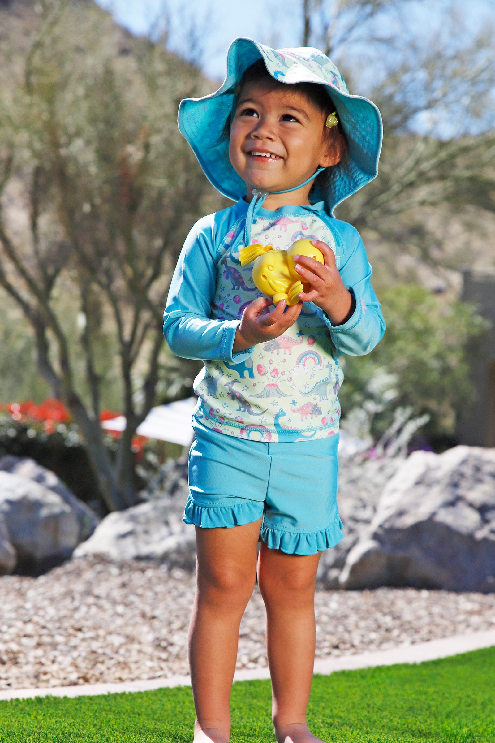 baby in ruffled swim shorties|aquamarine