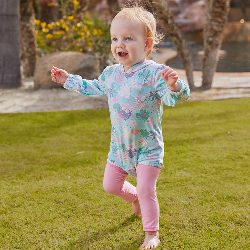 Little baby in UV Skinz's baby girl's hooded onesie in blooming oasis|blooming-oasis