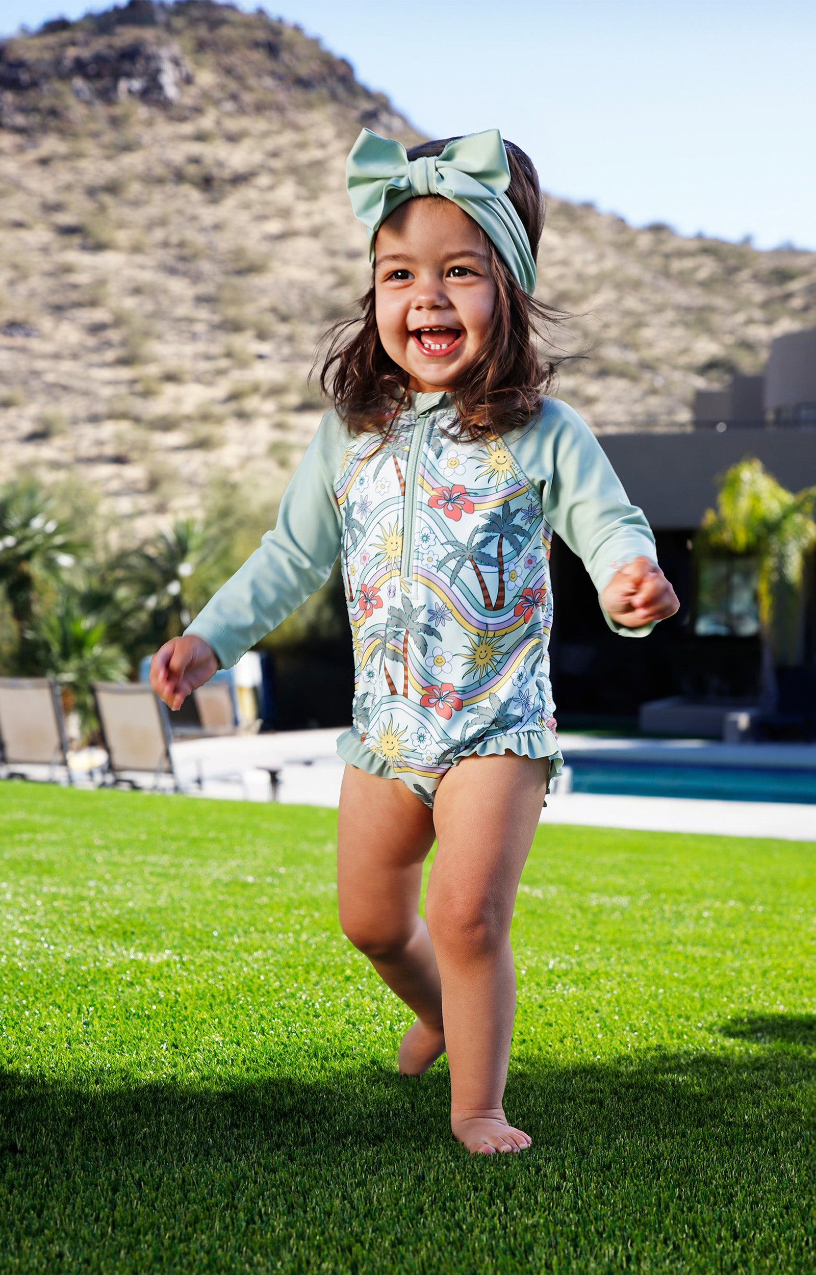 baby girl in long sleeve ruffled swim romper|retro-island