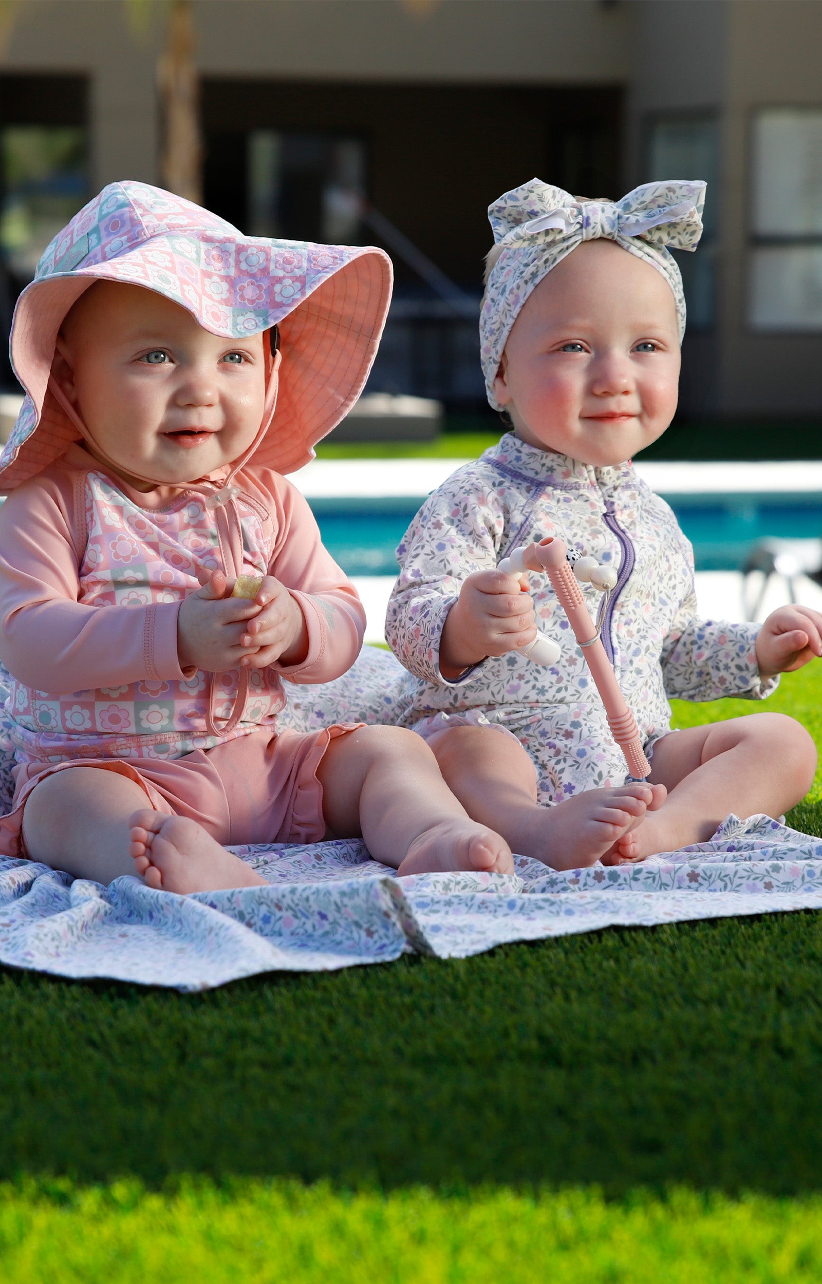 baby girl in long sleeve ruffled swim romper|sonora-meadows
