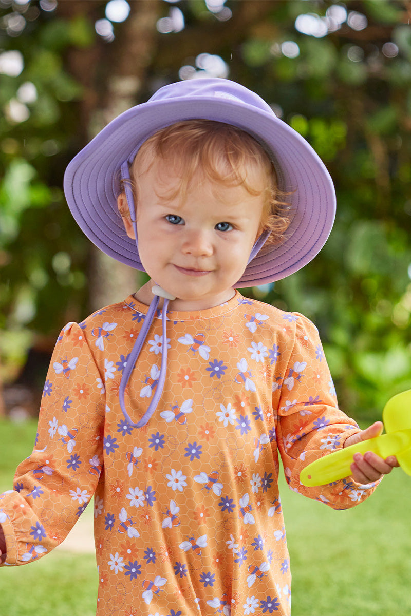 baby girl in swim hat|daybreak
