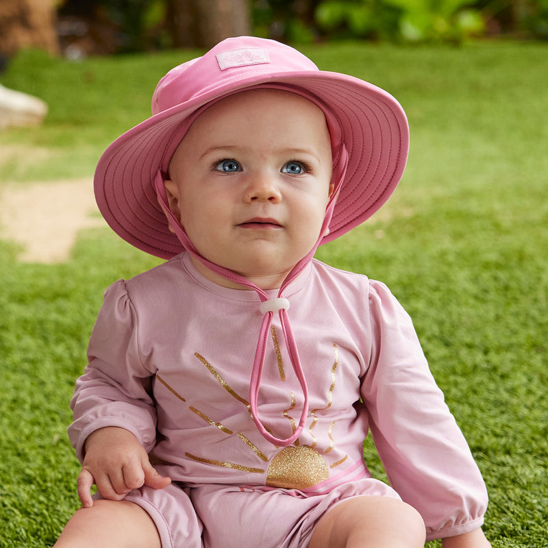 baby girl in swim hat|wild-rose
