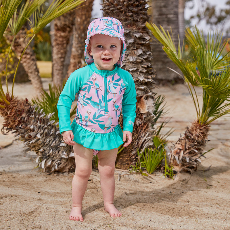 Baby girl in UV Skinz's baby girl's swim flap hat in birds in paradise|birds-in-paradise