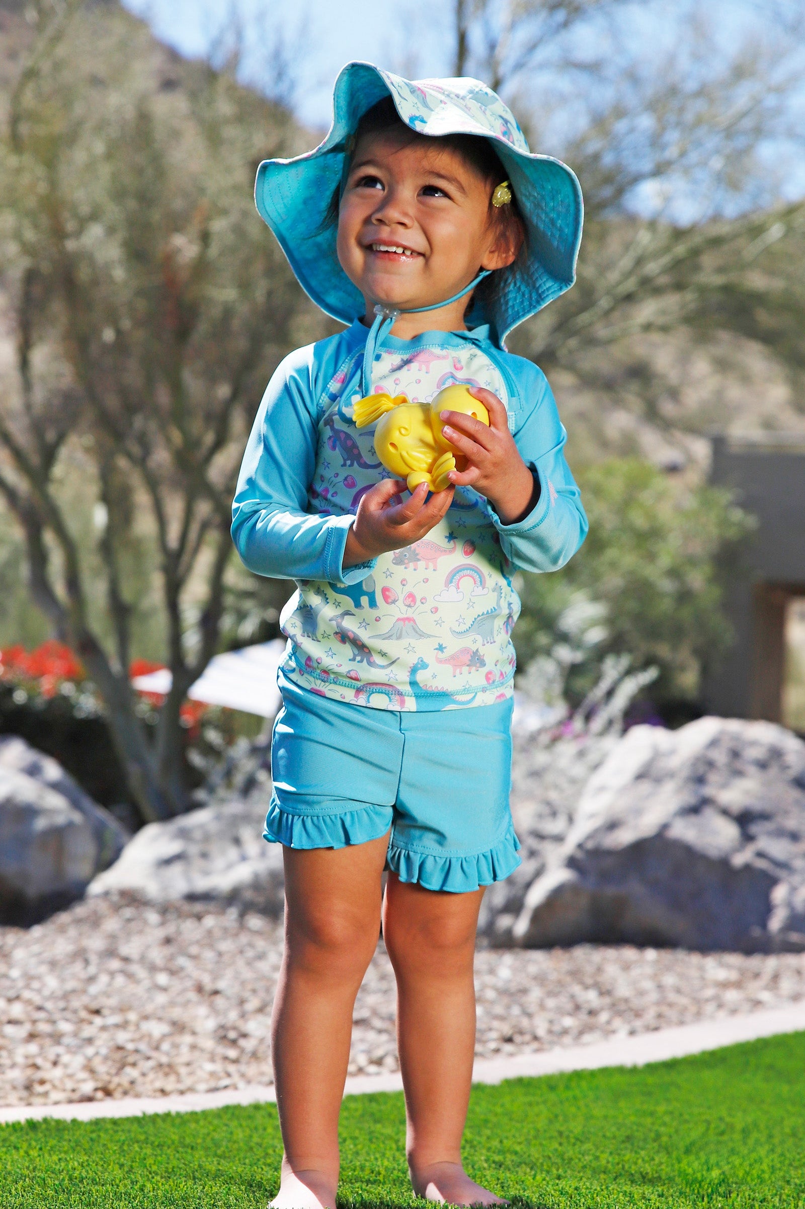 baby girl in scalloped bucket hat|colorful-wings