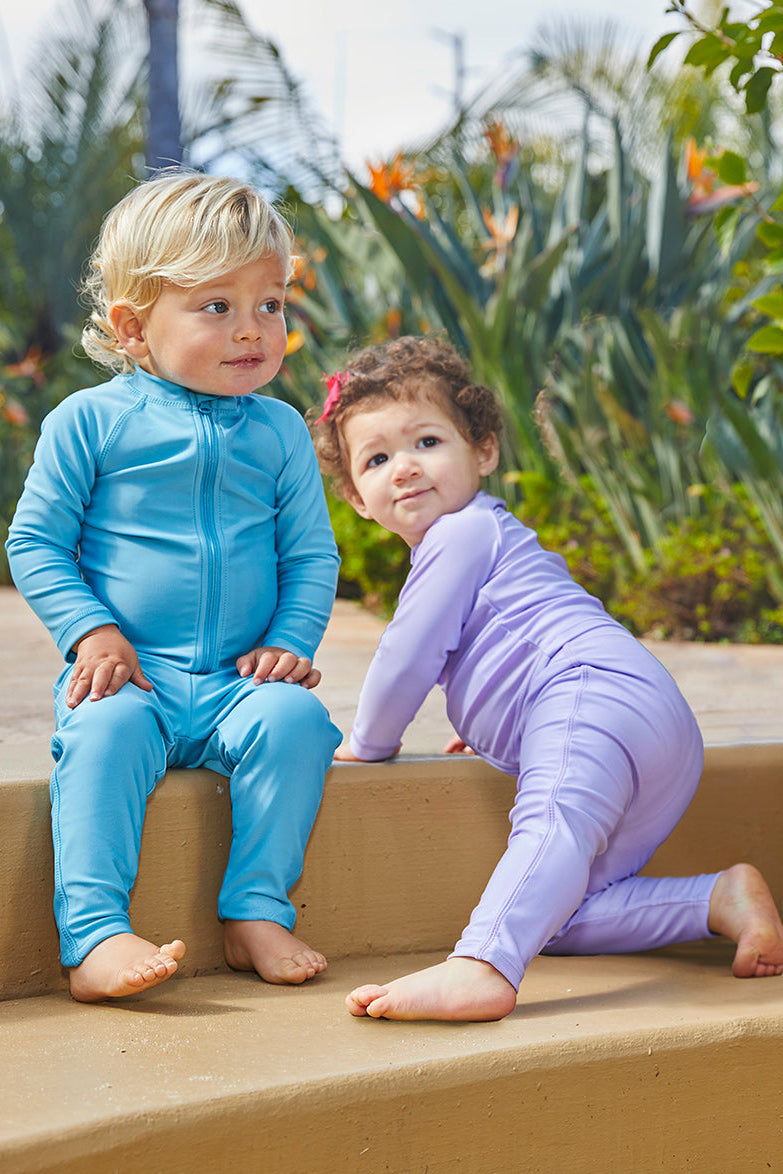 baby girl and baby boy in swim leggingz on stairs|lagoon