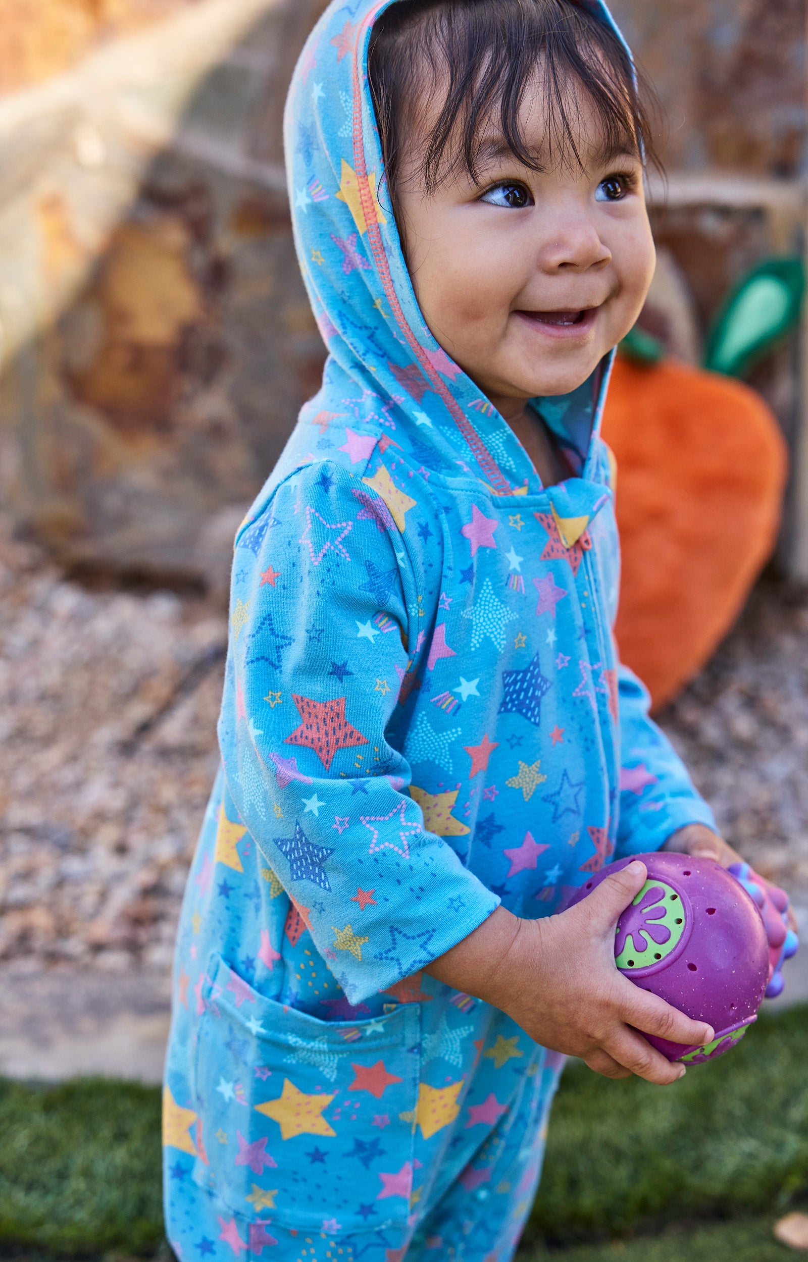baby girl in hooded romper|scribble-stars