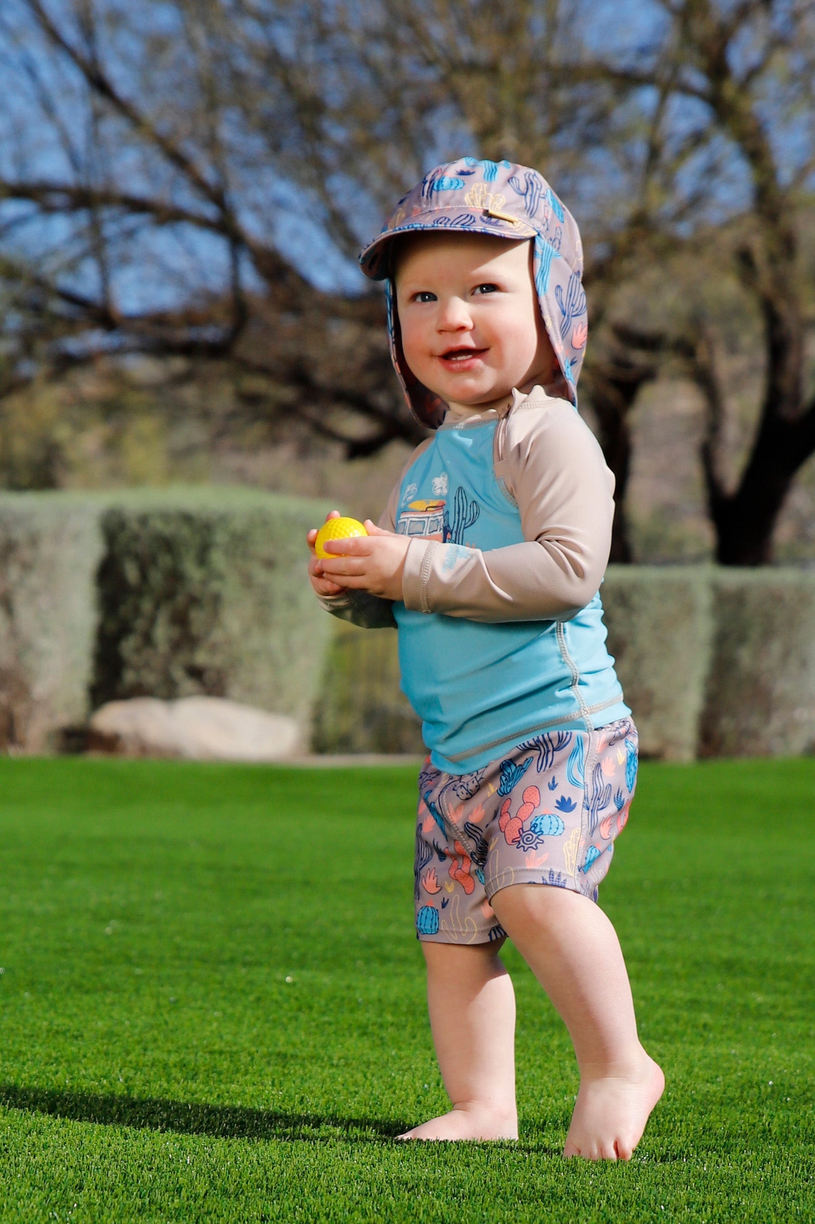 baby in swim shorties|cactus-crowd