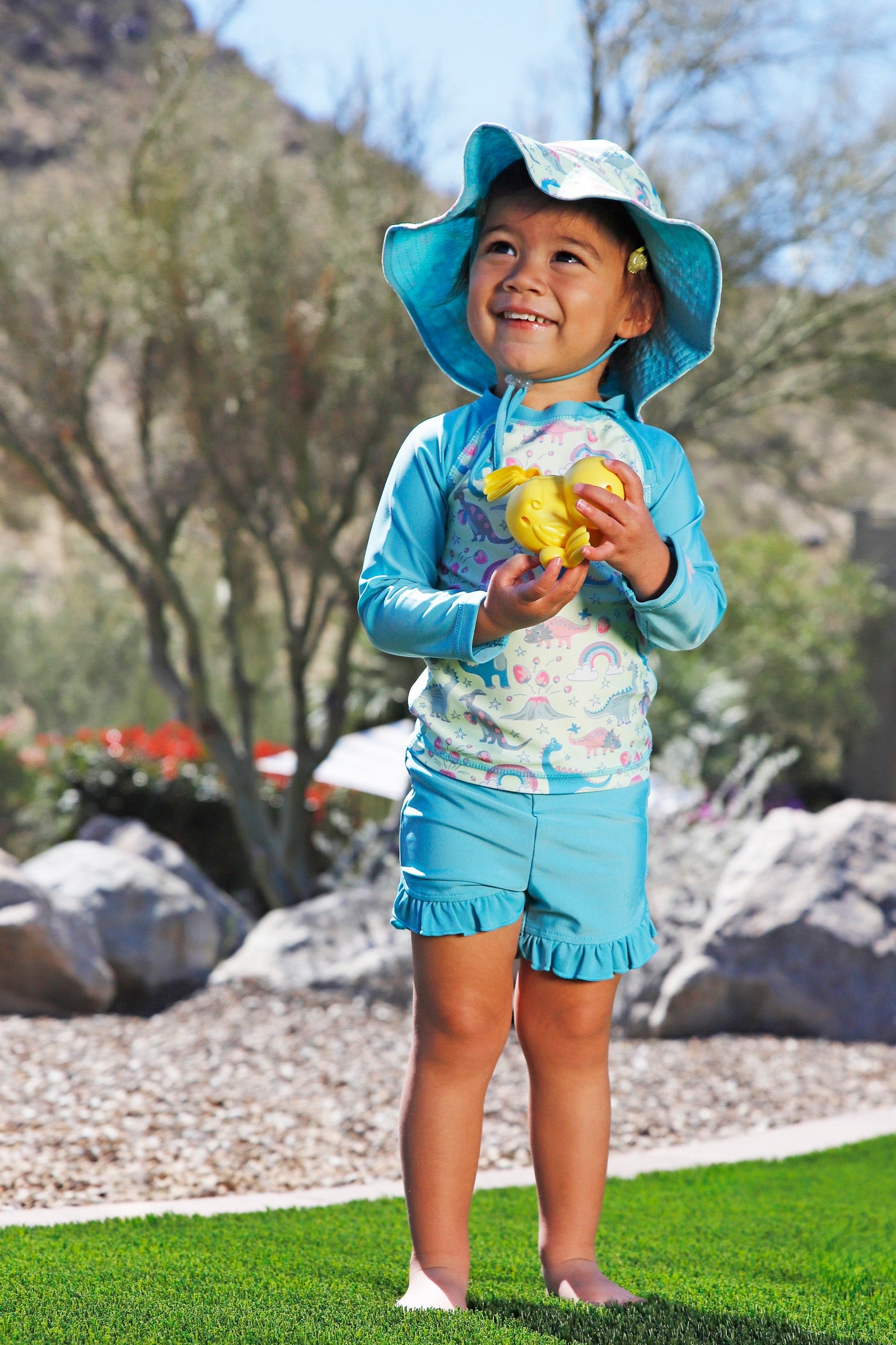baby in zippy long sleeve sun and swim shirt|dino-berry
