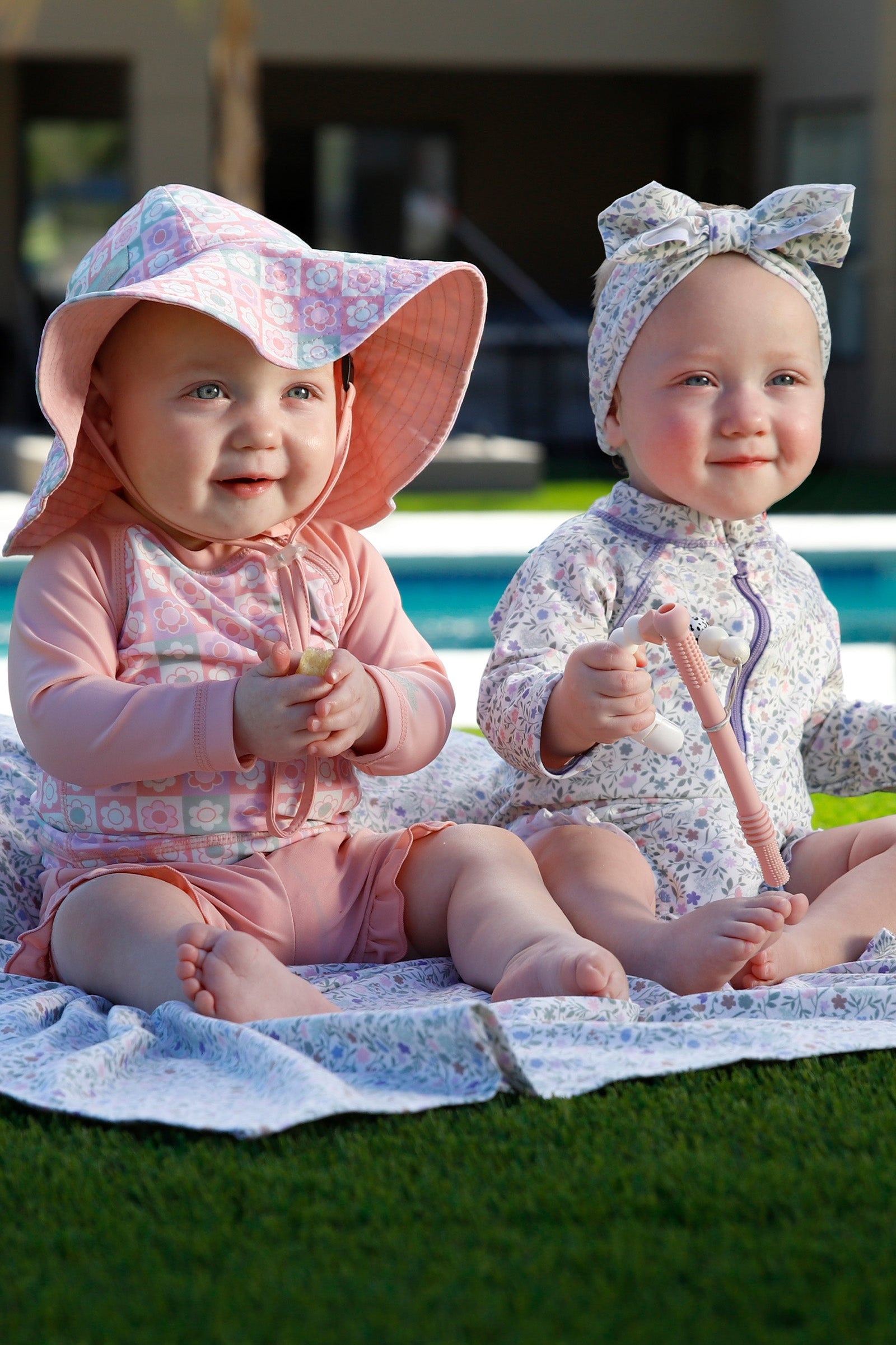 baby in long sleeve zippy sun and swim suit|tiled-flowers