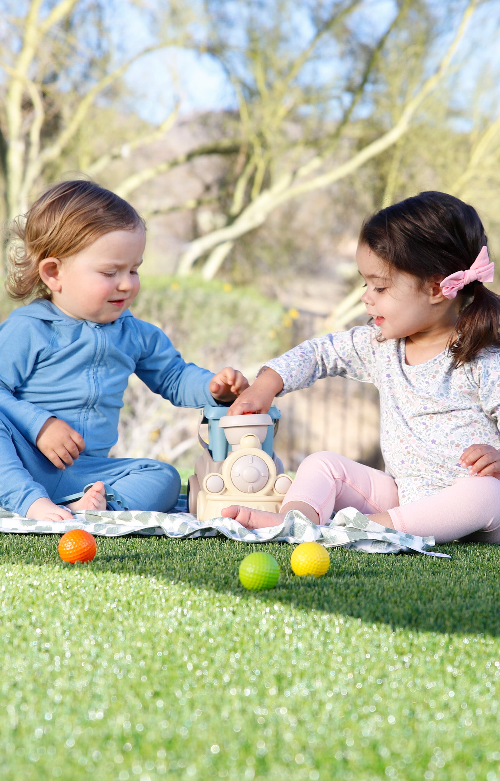 babies playing on my first sun blanket|painted-checkers