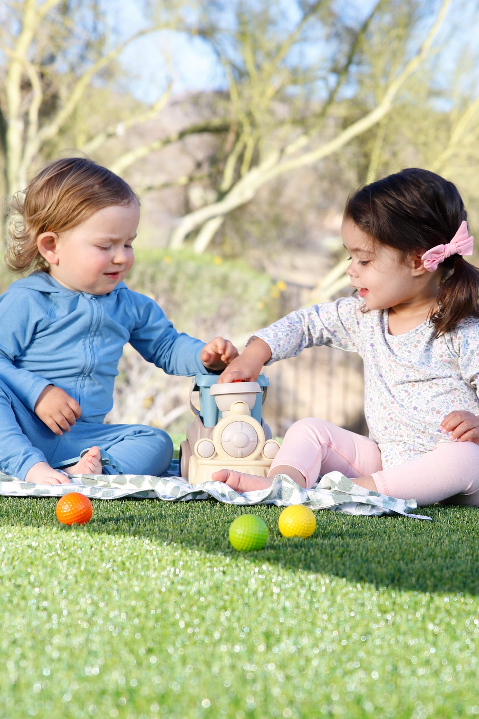 babies playing on my first sun blanket|painted-checkers