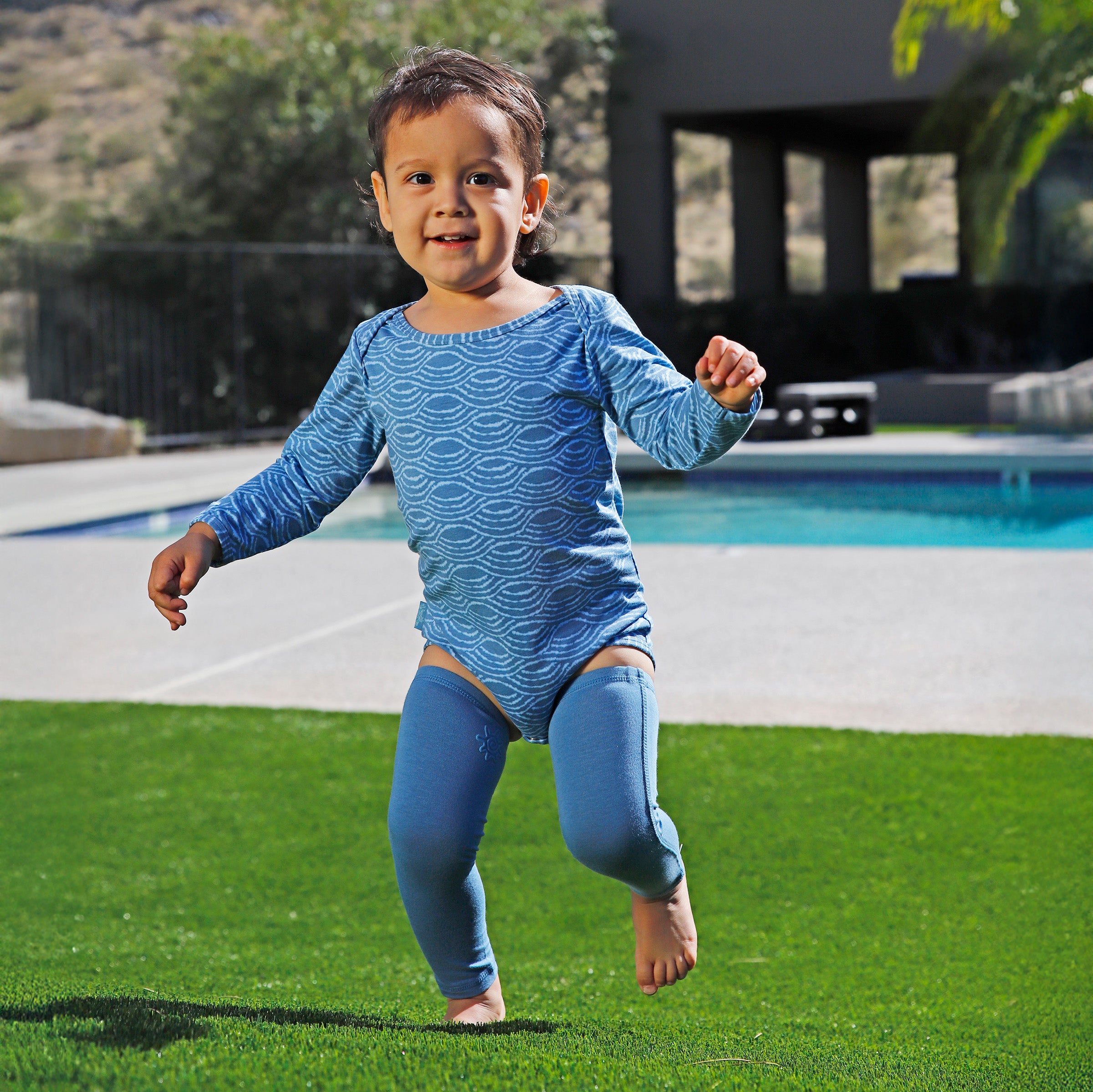 baby playing in bamboo sun legz|baltic