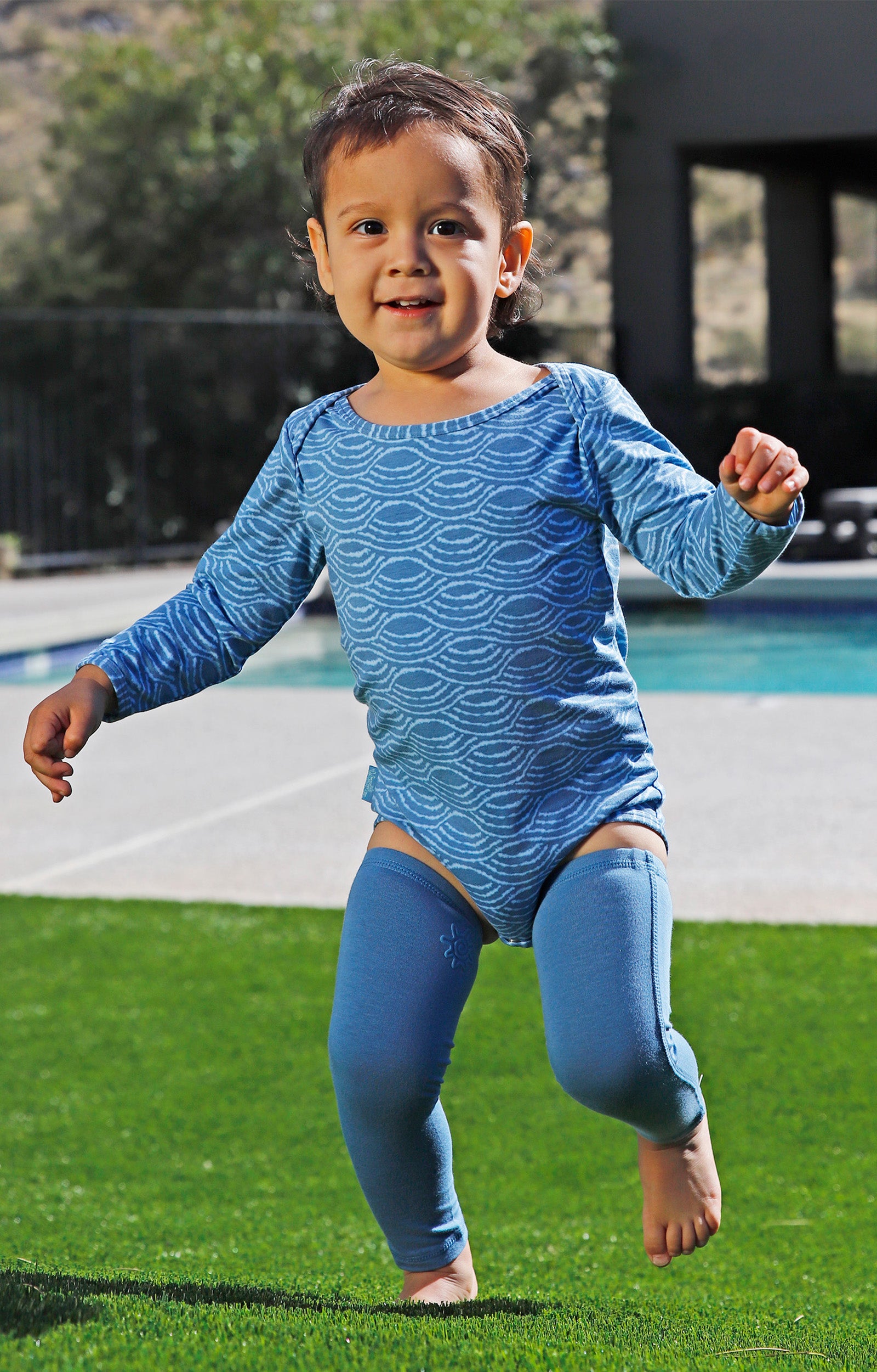 baby playing in bamboo sun legz|baltic