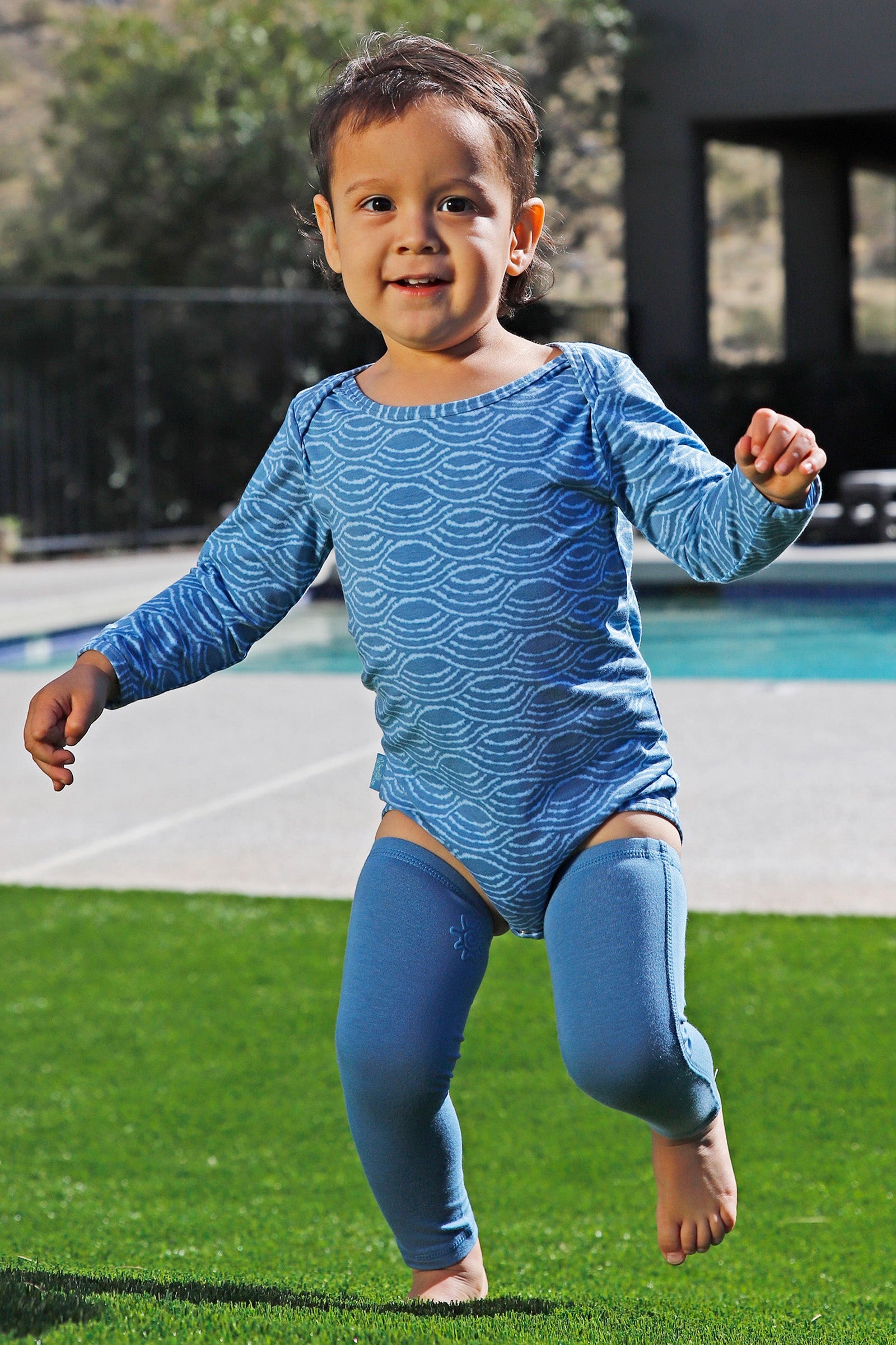 baby playing in bamboo sun legz|baltic