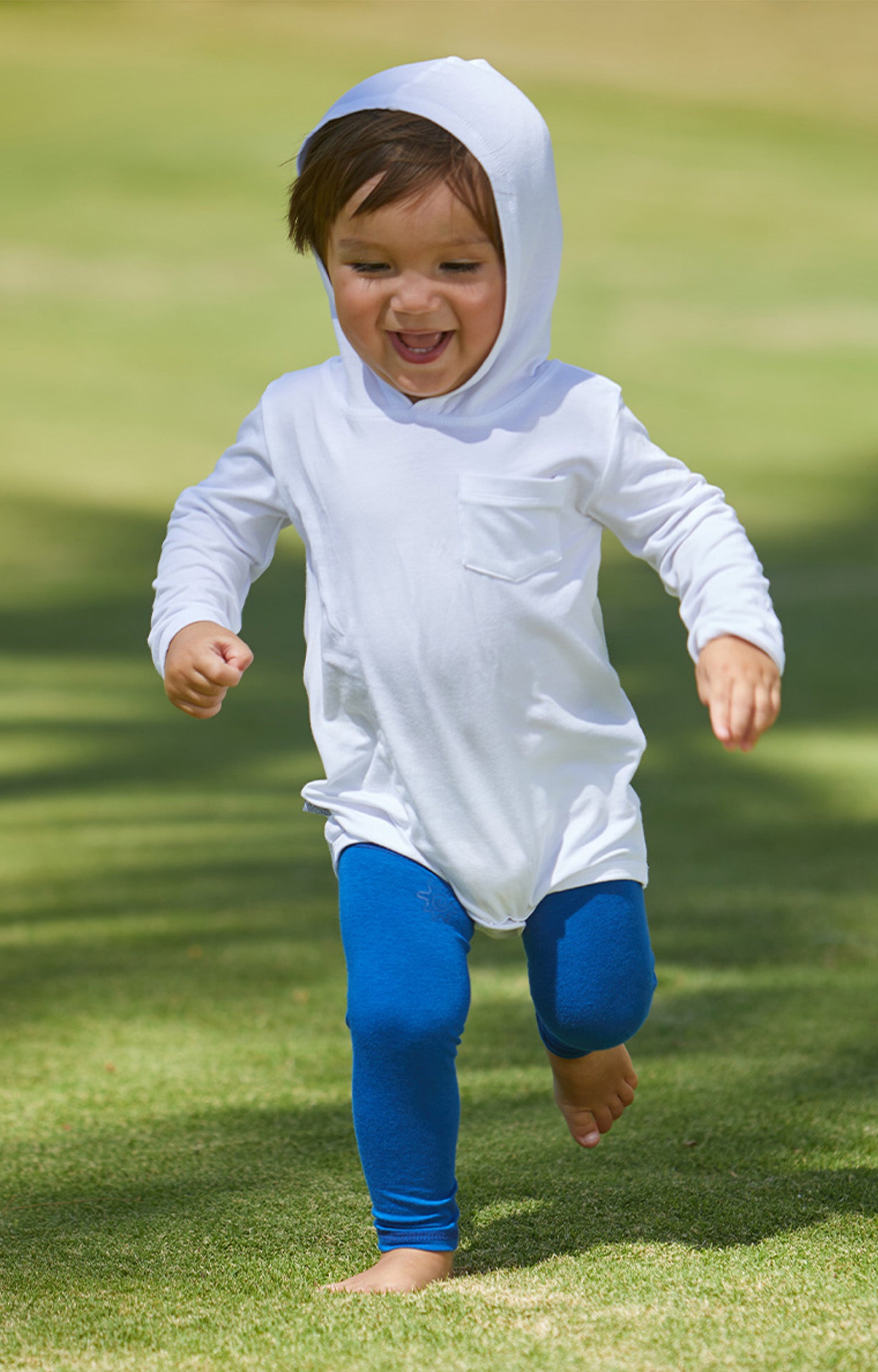 Baby Playing in UV Skinz's Baby Bamboo Sun Legz™ in Navy Blue|navy-blue