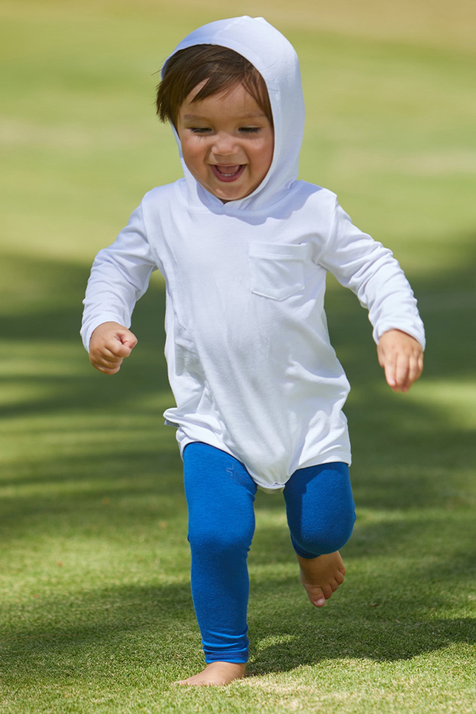 Baby Playing in UV Skinz's Baby Bamboo Sun Legz™ in Navy Blue|navy-blue