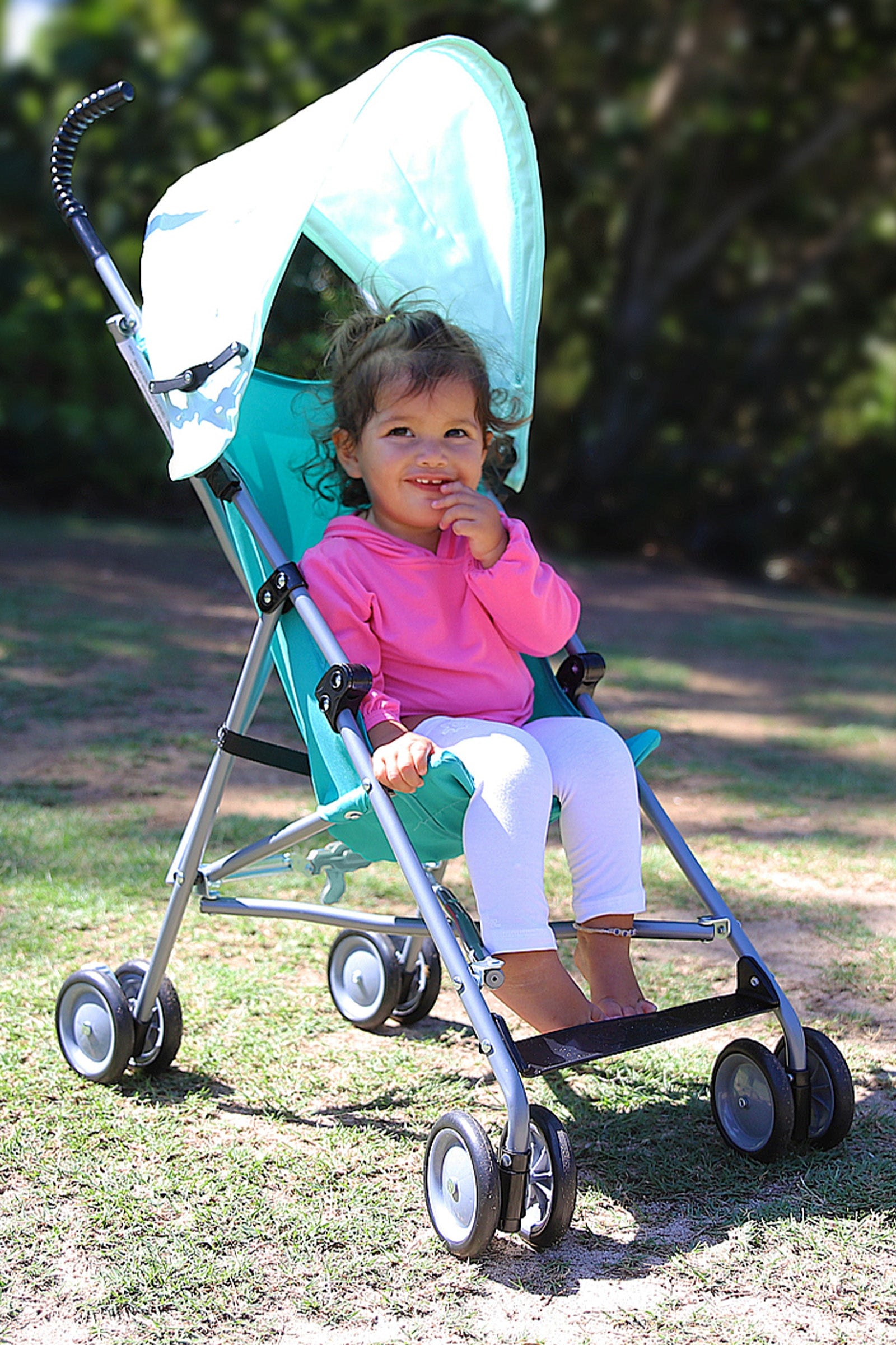 Baby Girl in Stroller in UV Skinz's Baby Bamboo Sun Legz™ in White|white