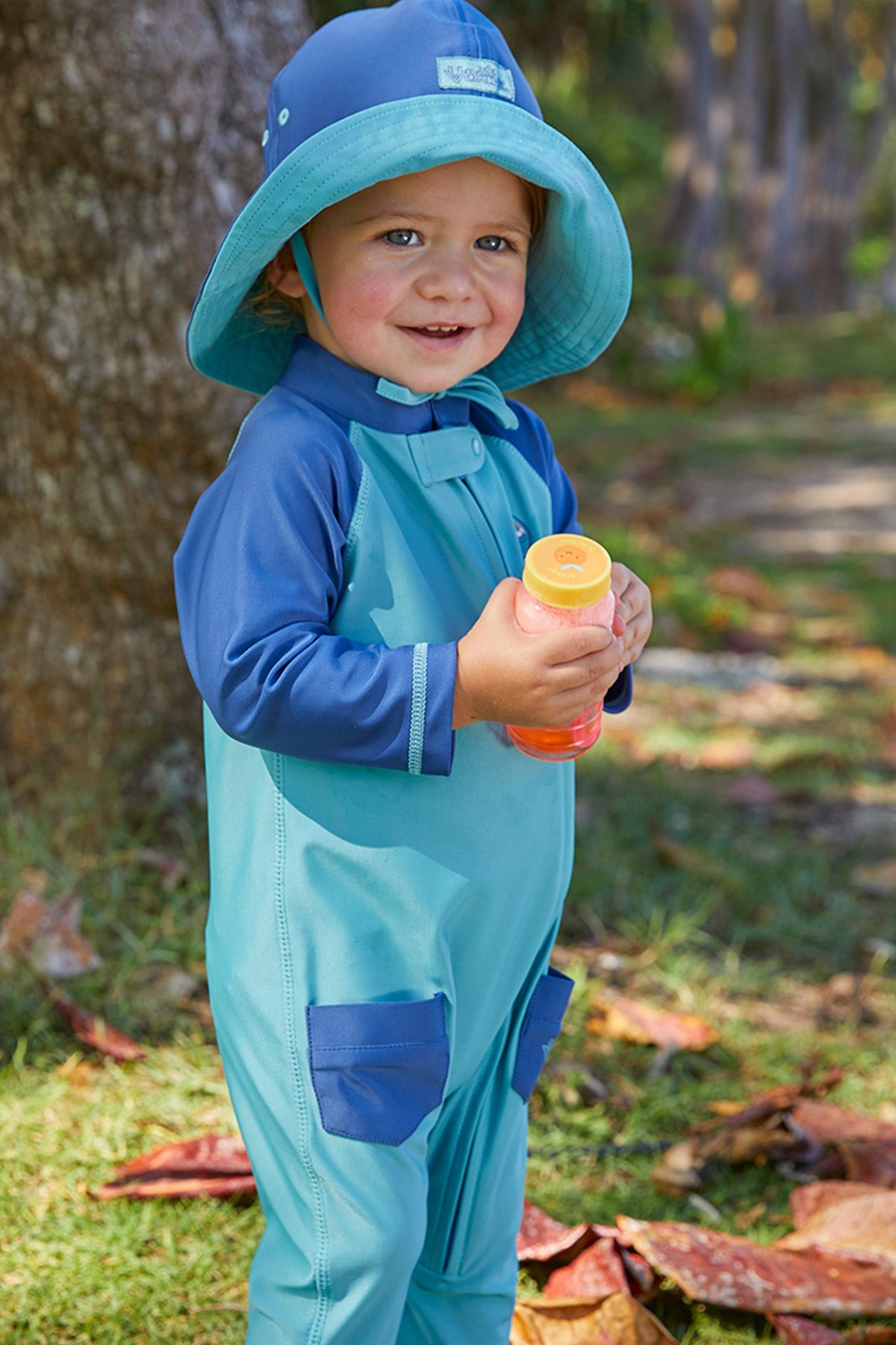 Baby in UV Skinz's baby boy's long-sleeve swimsuit in endless summer|endless-summer