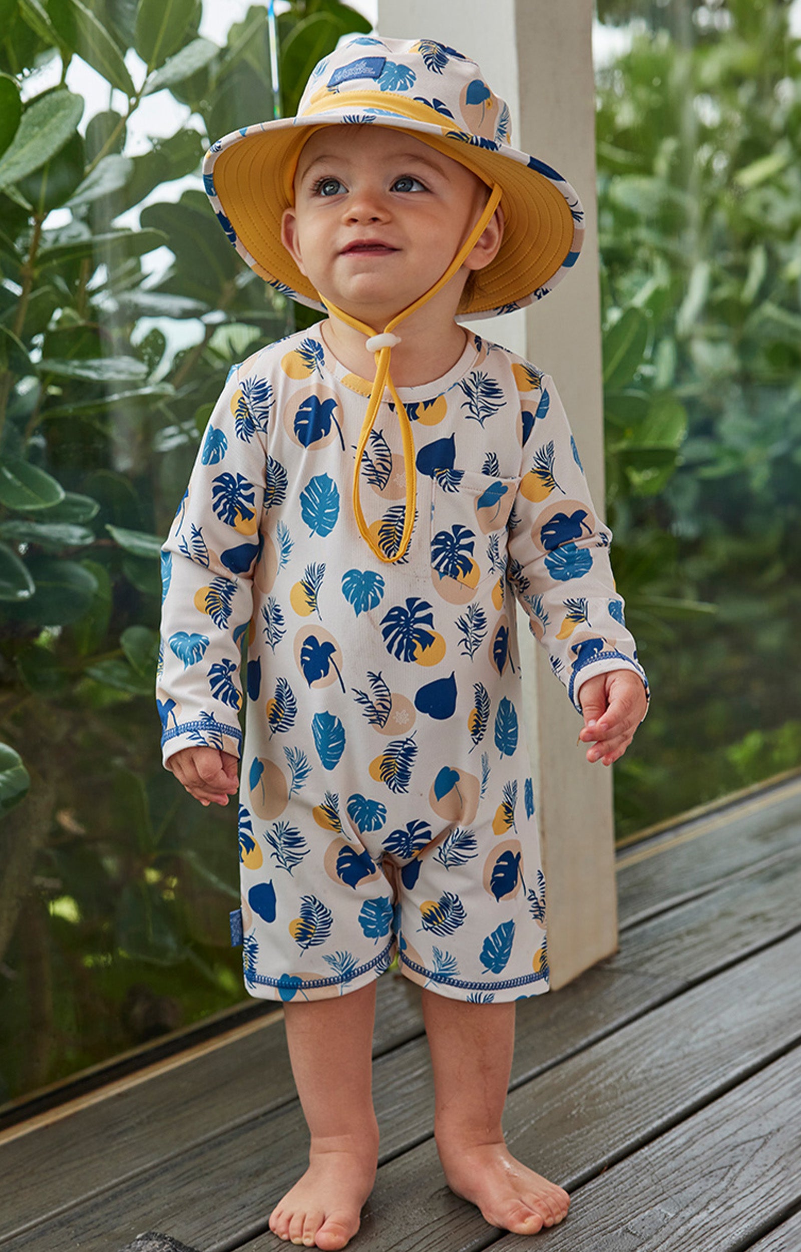 baby boy in swim hat|shadow-leaf