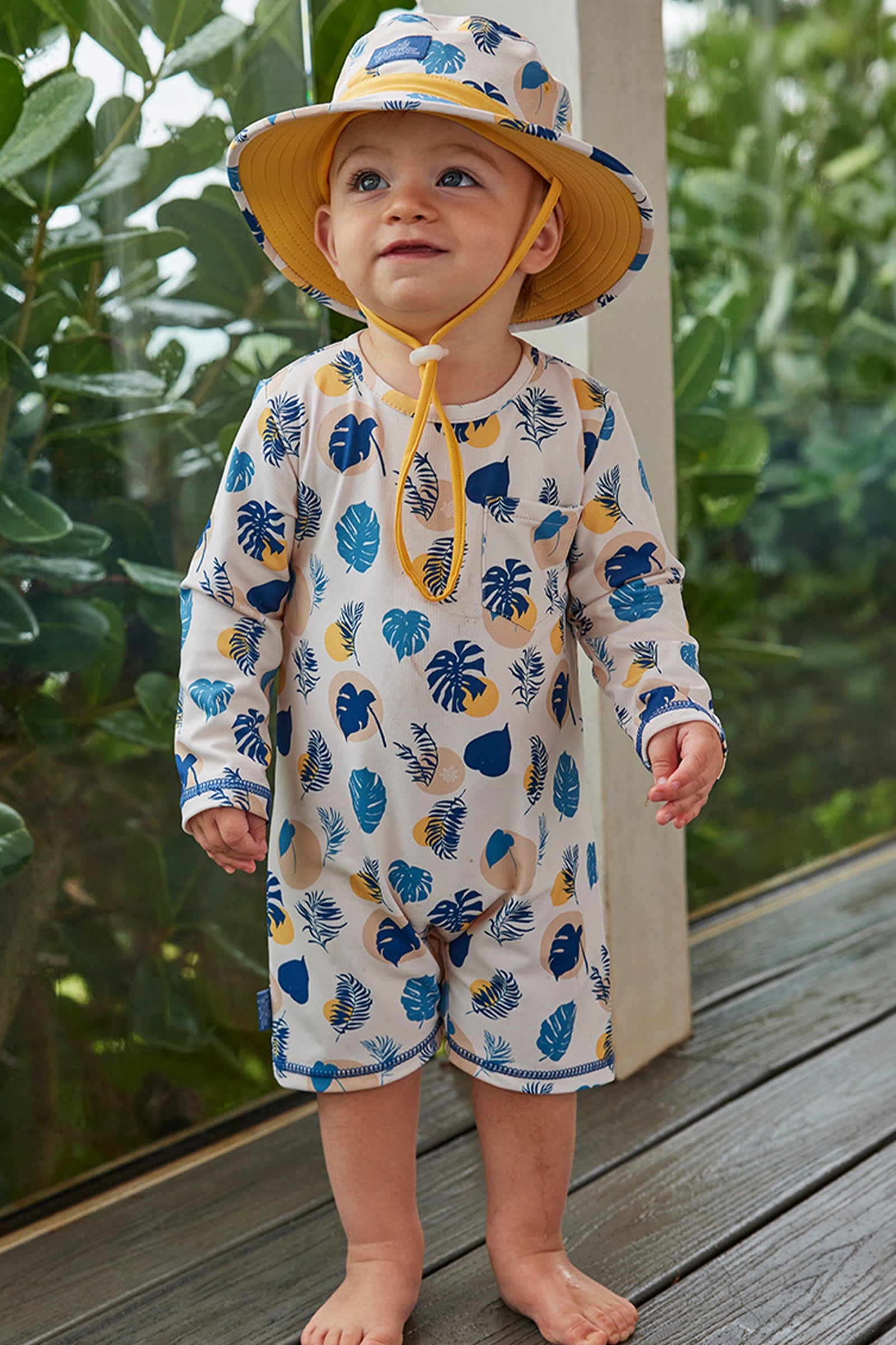 baby boy in swim hat|shadow-leaf