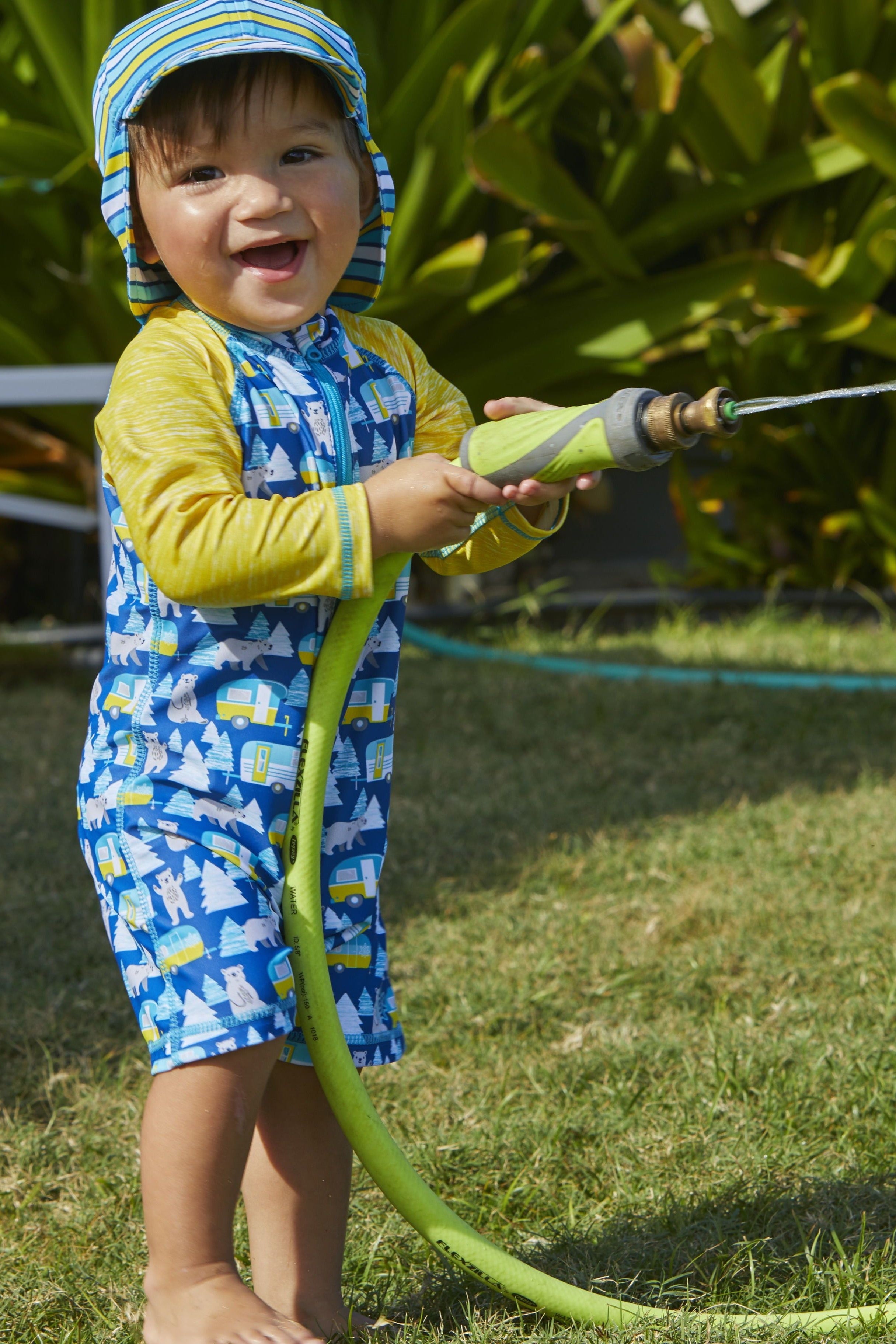 Little boy in UV Skinz's baby UPF bathing suit|camper-bear