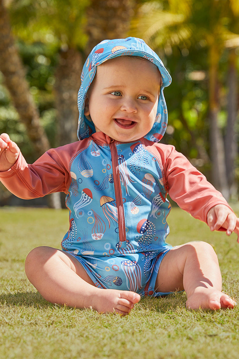 Little boy in UV Skinz's baby boy's long sleeve swimsuit|birdie-stripe