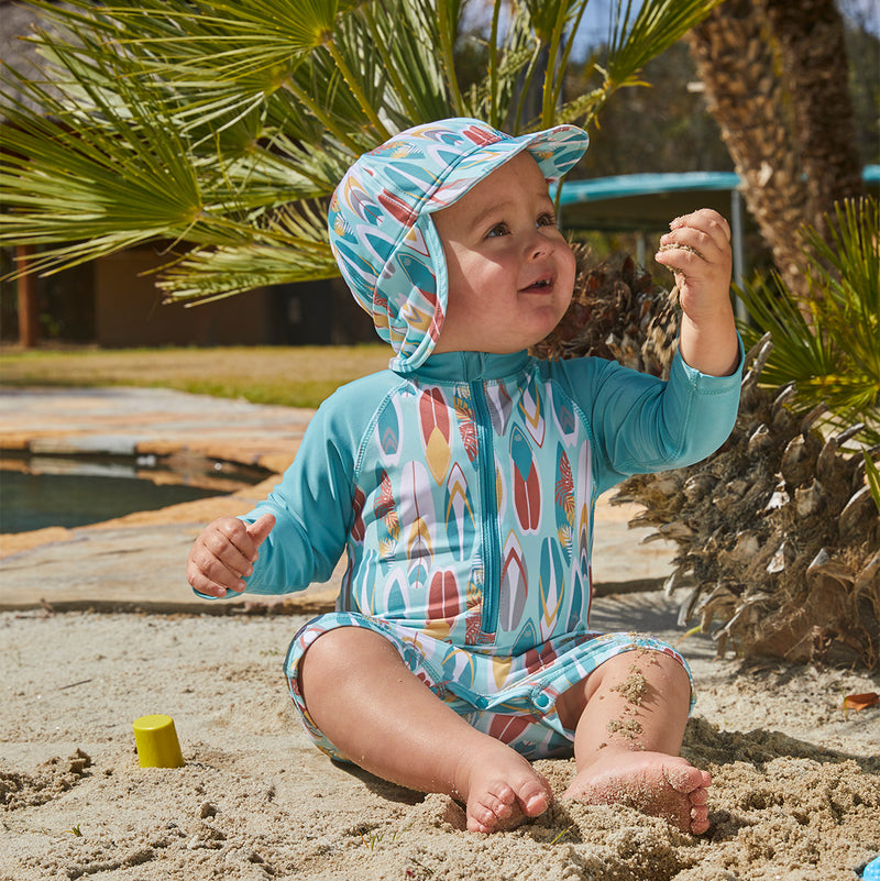 baby in UV Skinz's baby boy's long sleeve swimsuit in surfs up|surfs-up