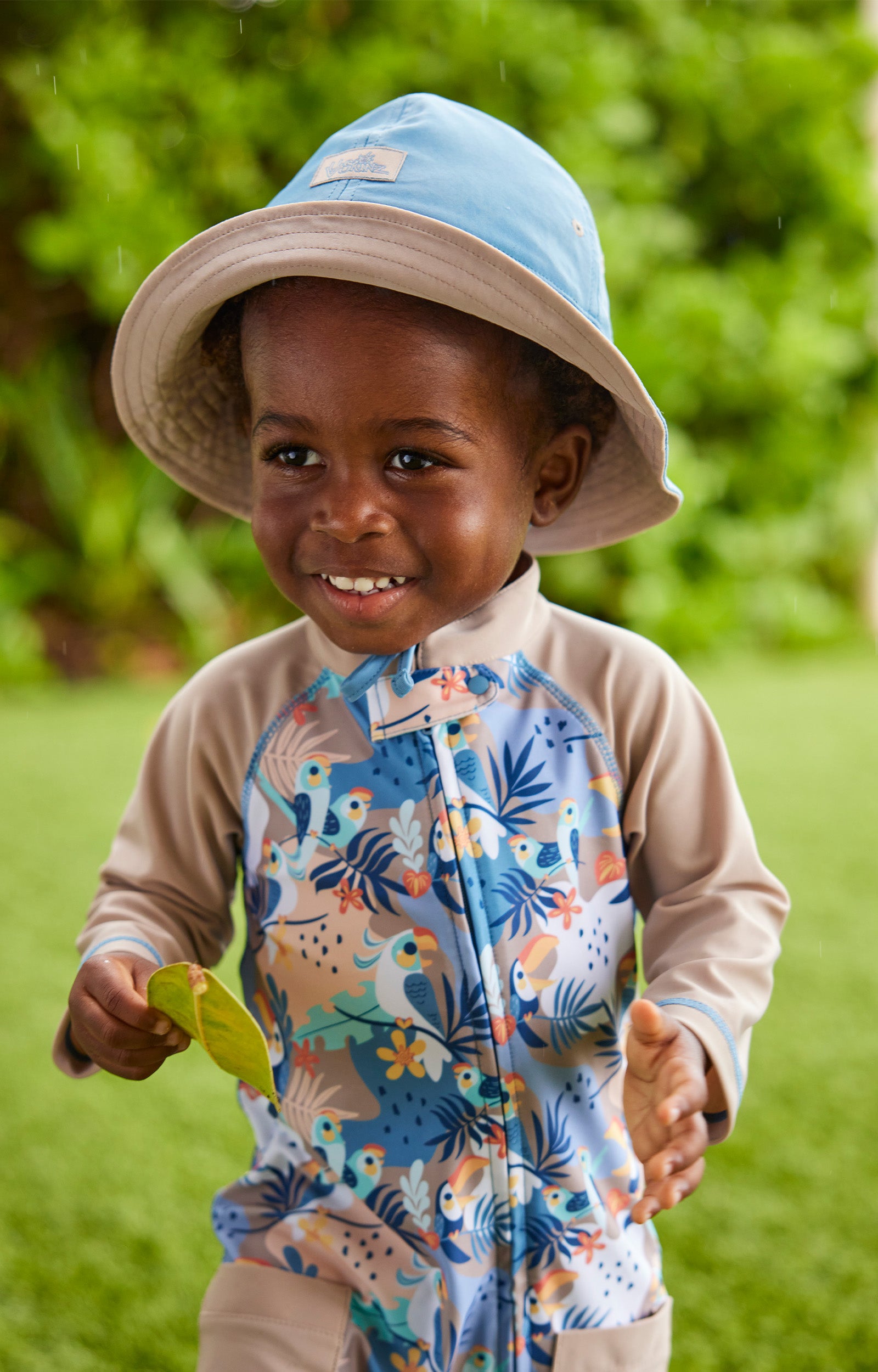 baby boy in reversible sun hat|baltic-sandstone