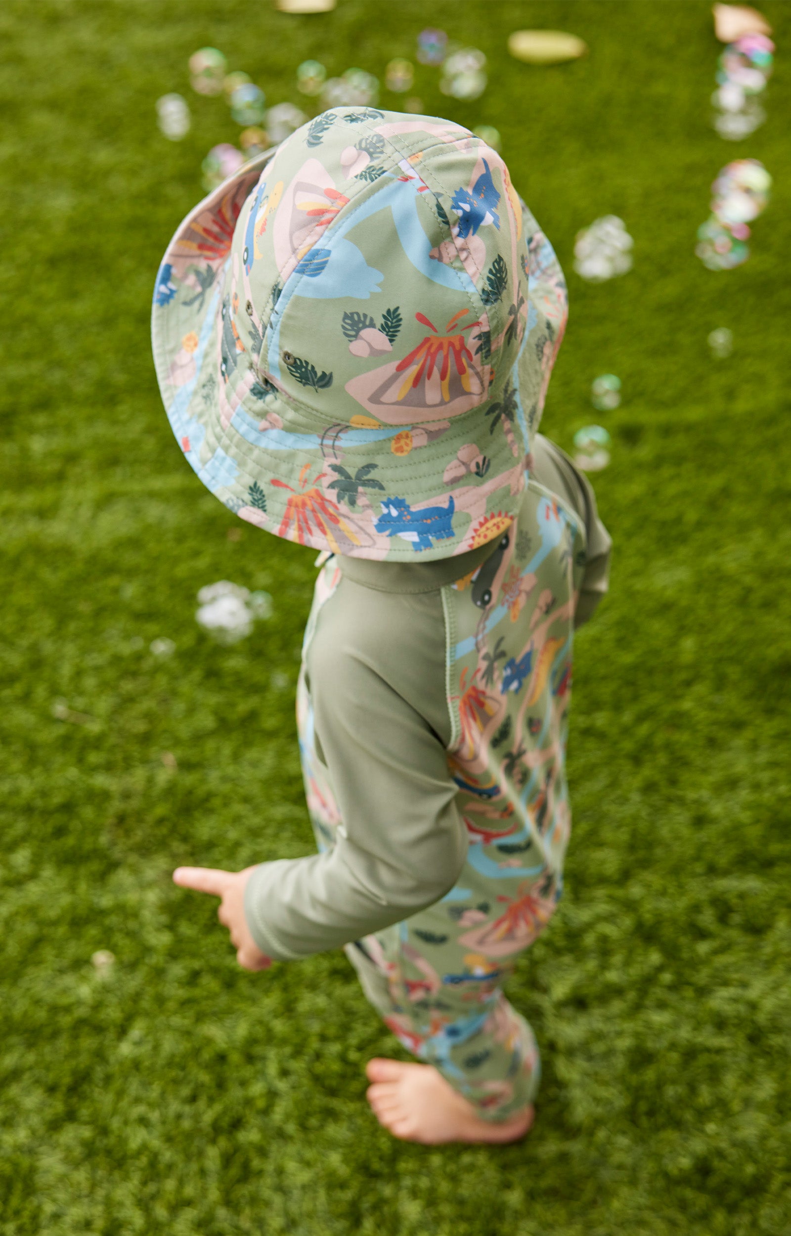 back view of baby boy in reversible sun hat|dinoville