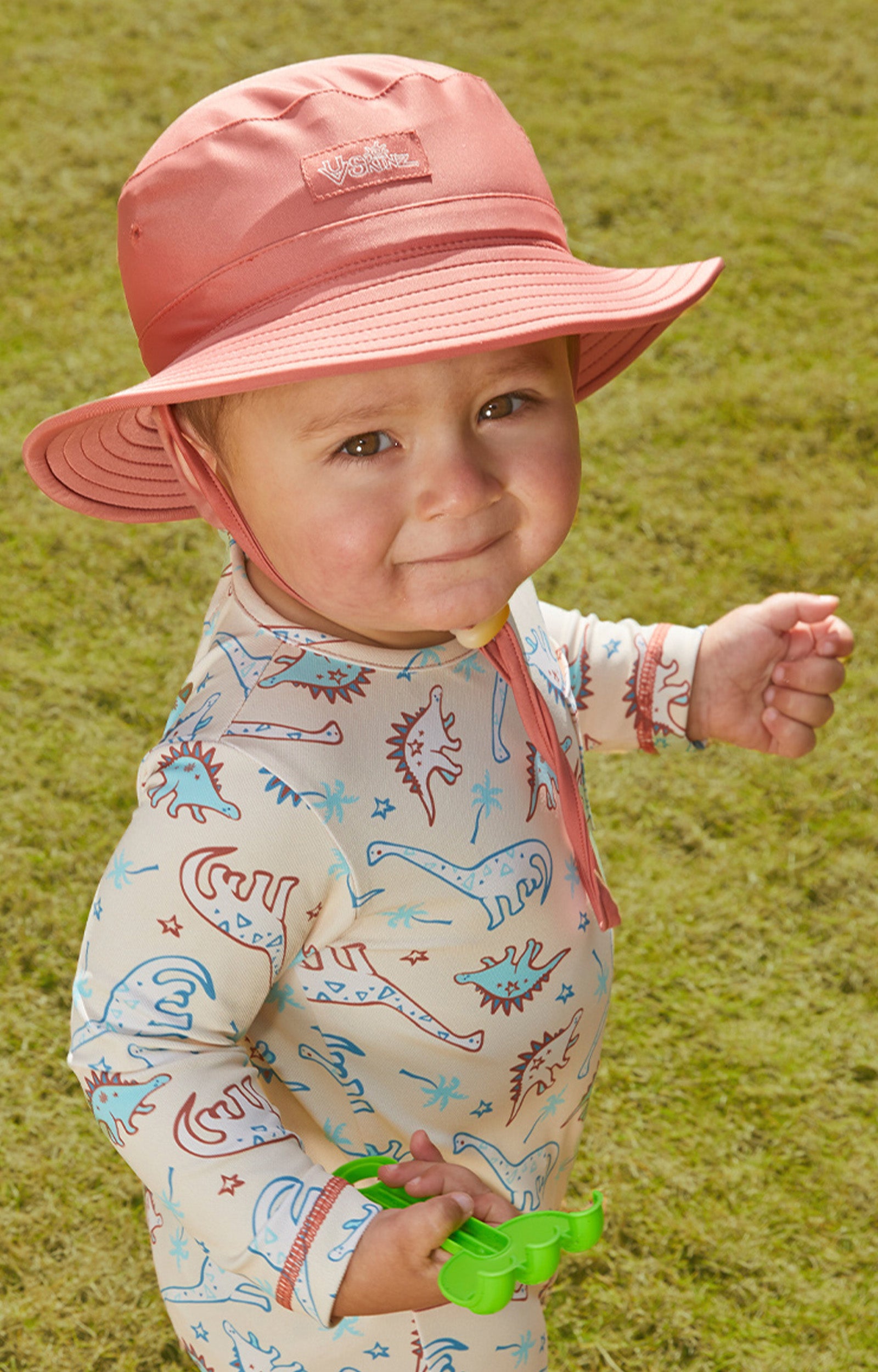 Little baby boy in UV Skinz's baby boy's swim hat in canyon|beach-glass