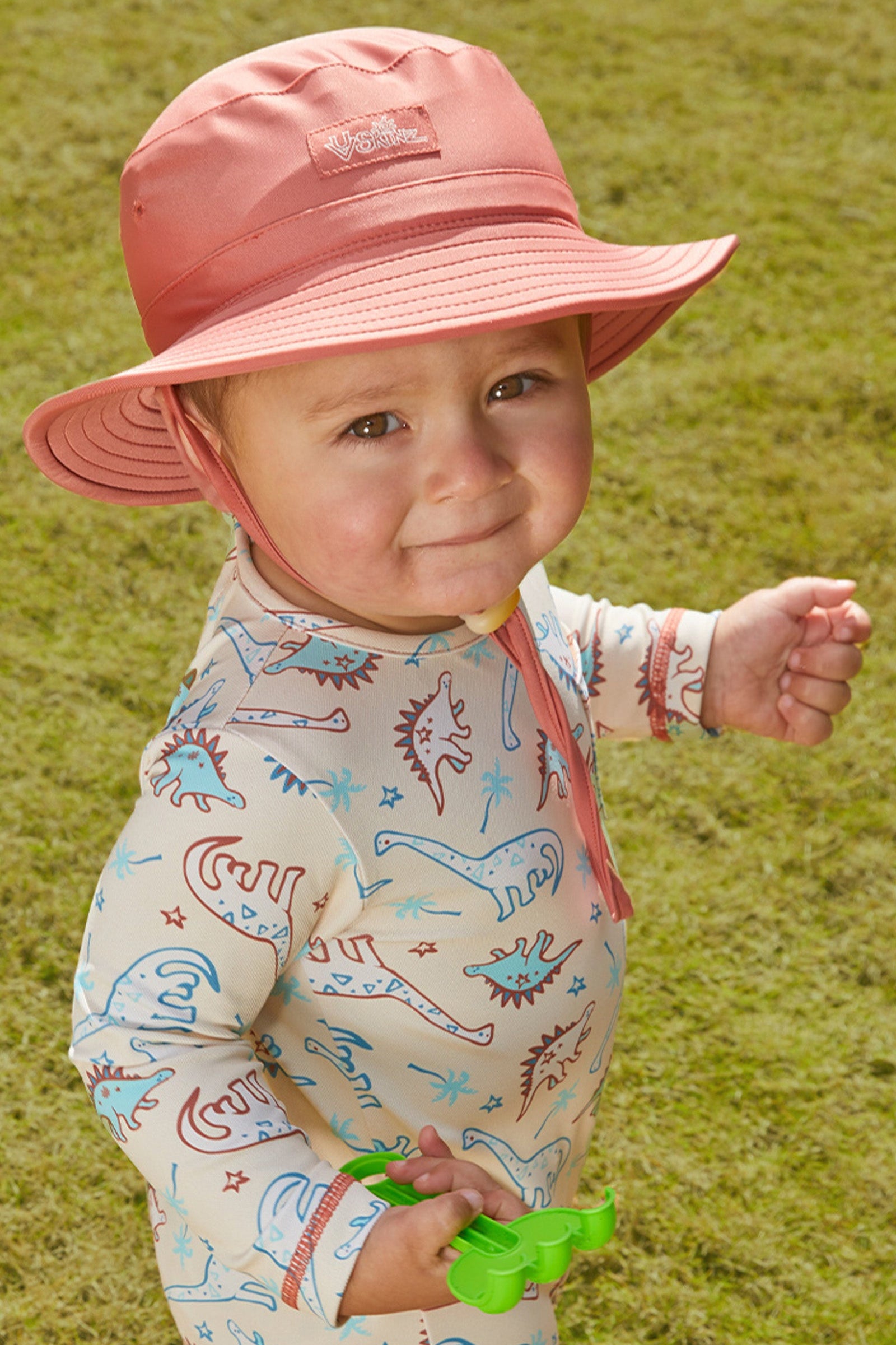 Baby boy in UV Skinz's baby boy's swim hat|canyon