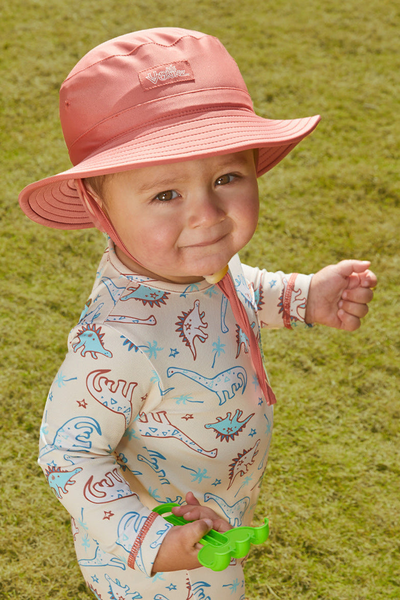 Baby boy in UV Skinz's baby boy's swim hat|canyon