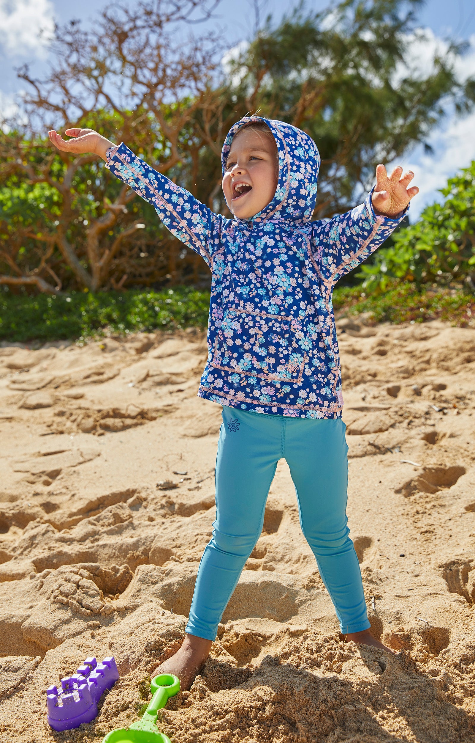 girls playing on the beach in UV Skinz's swim leggings|navy-blue
