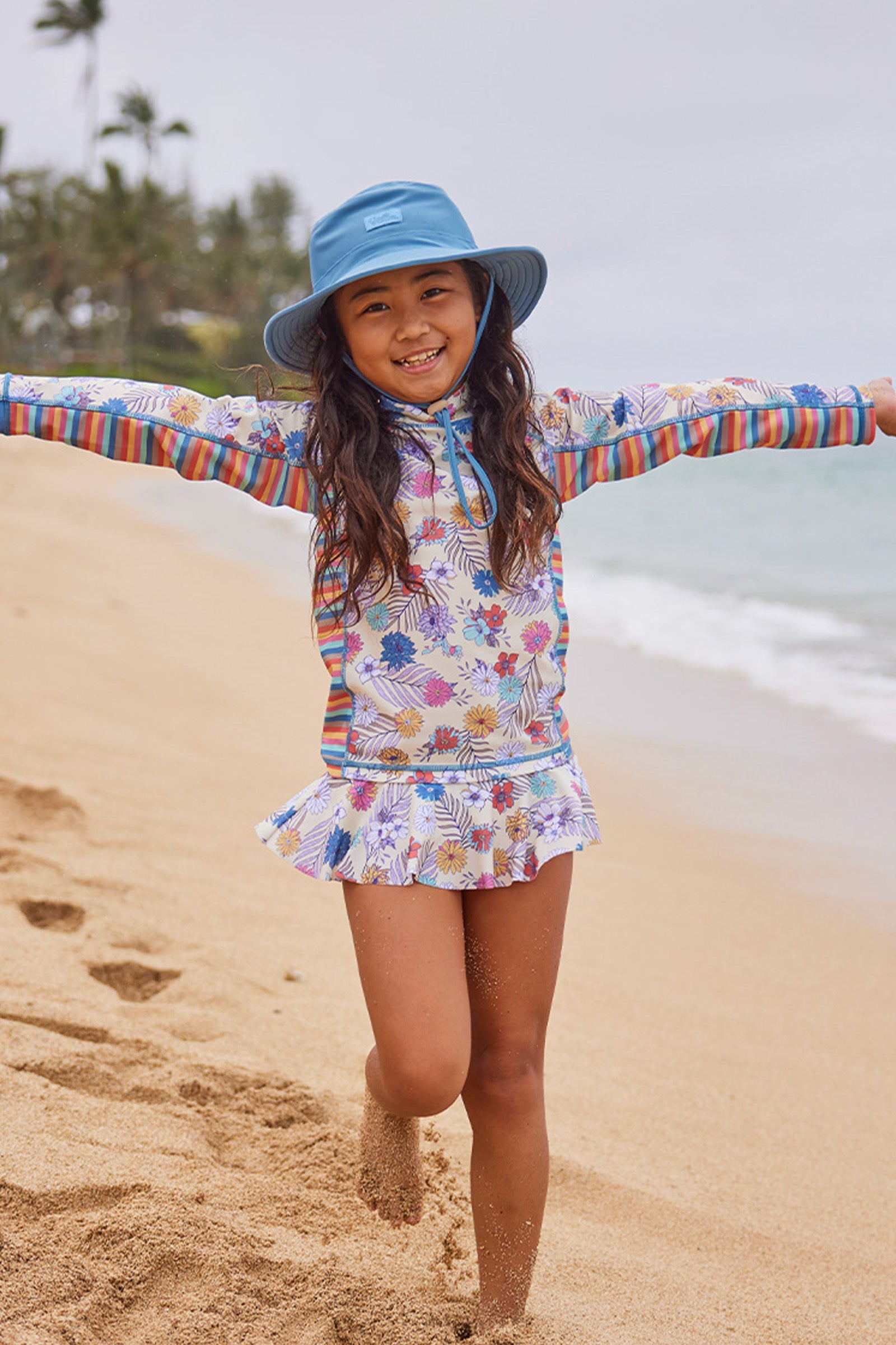 girl running on beach in 2pc long sleeve sunny swim set|summer-garden