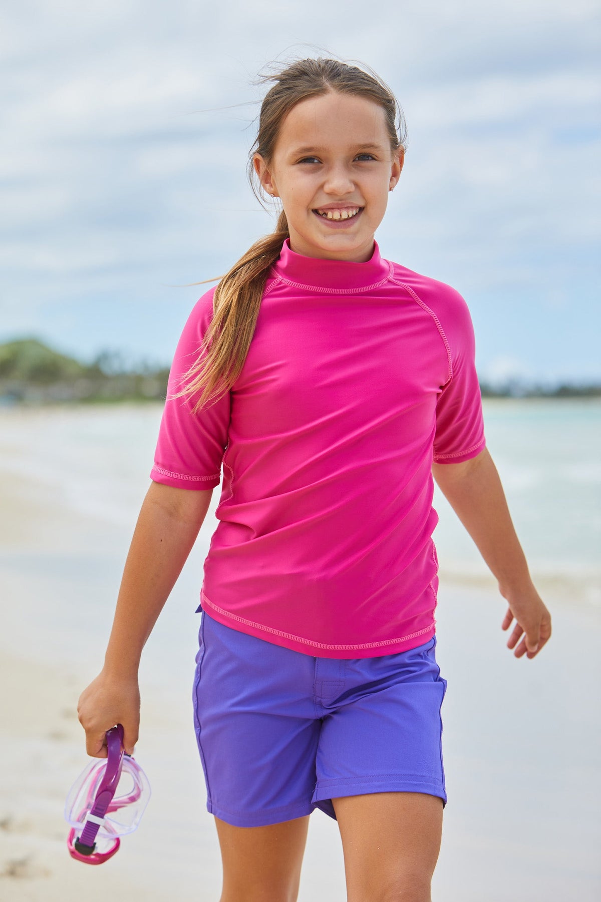Girl in UV Skinz's purple board shorts|purple