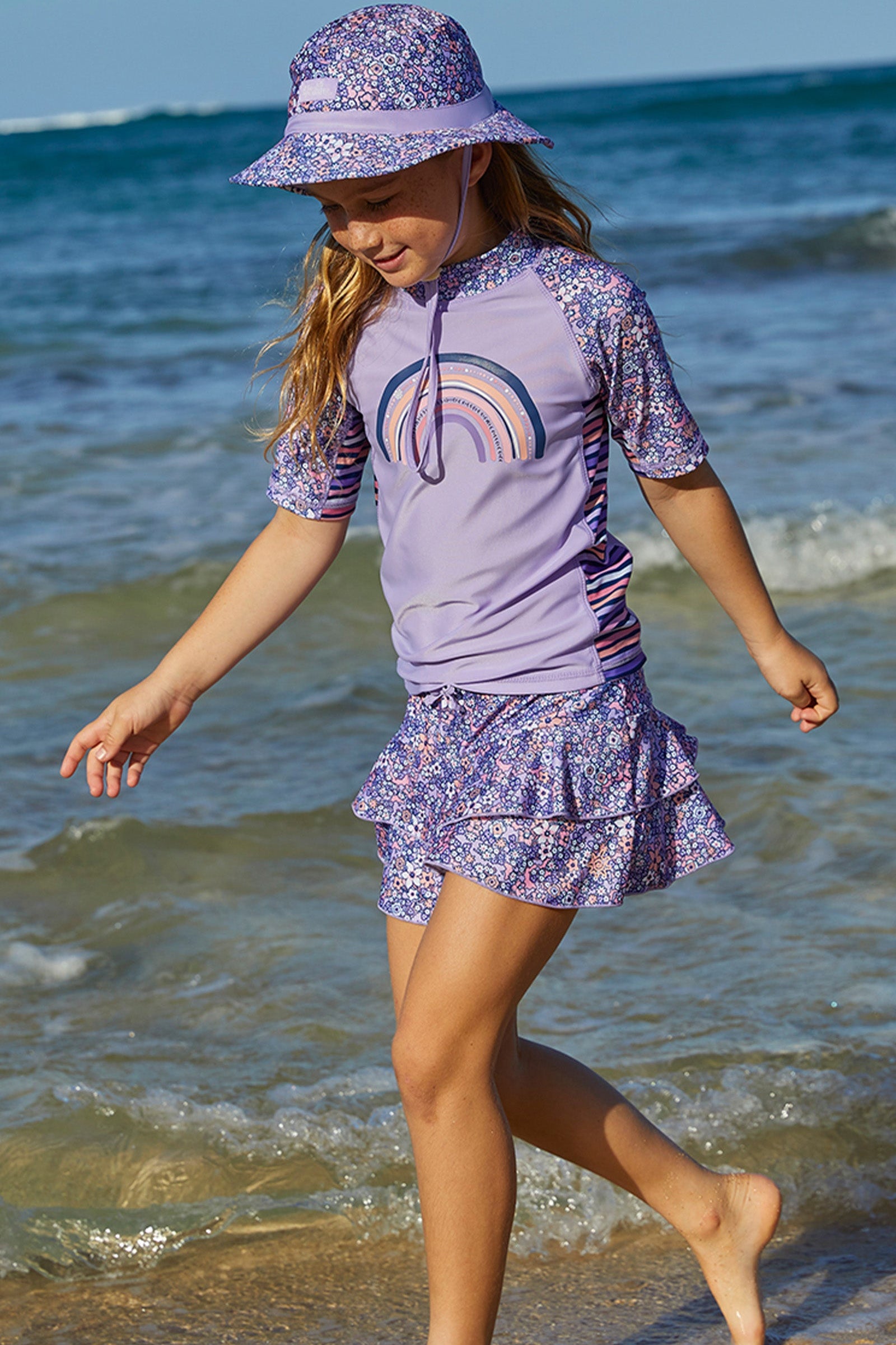 Girl wearing UV Skinz's girls swim skirt in lavender fields|lavender-fields