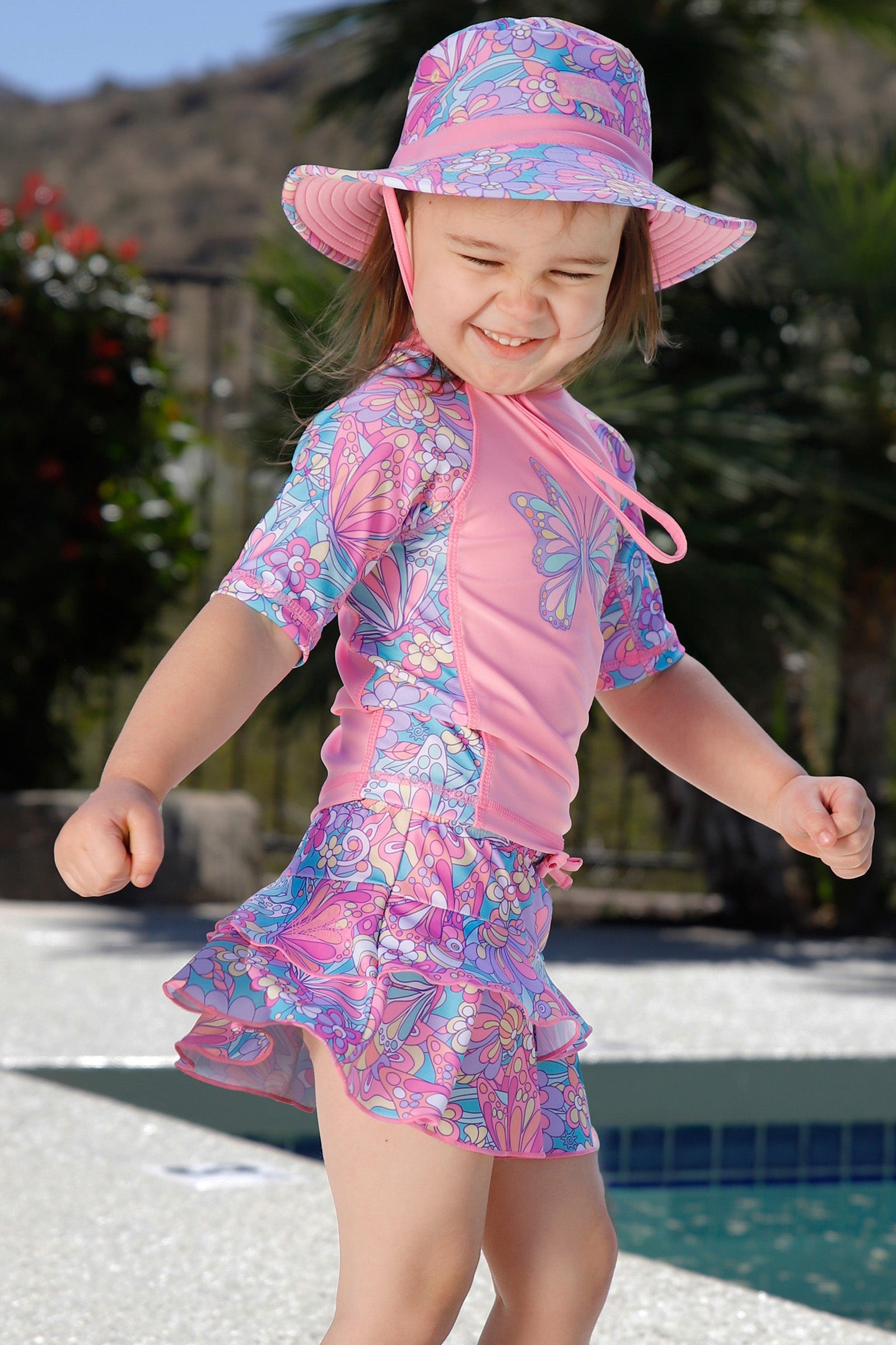 girl dancing by the pool in girls sunny swim skirt|mosaic-butterflies