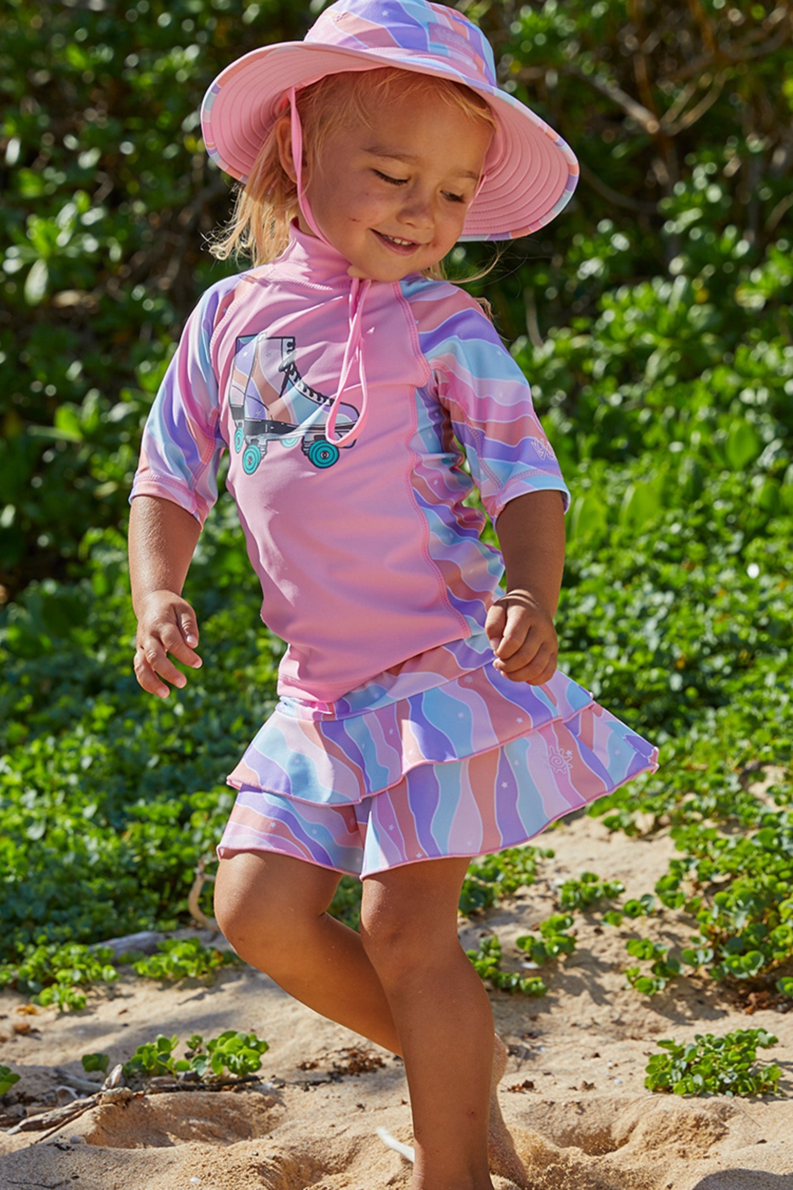 Girl in UV Skinz's girls swim skirt in rollin along|rollin-along