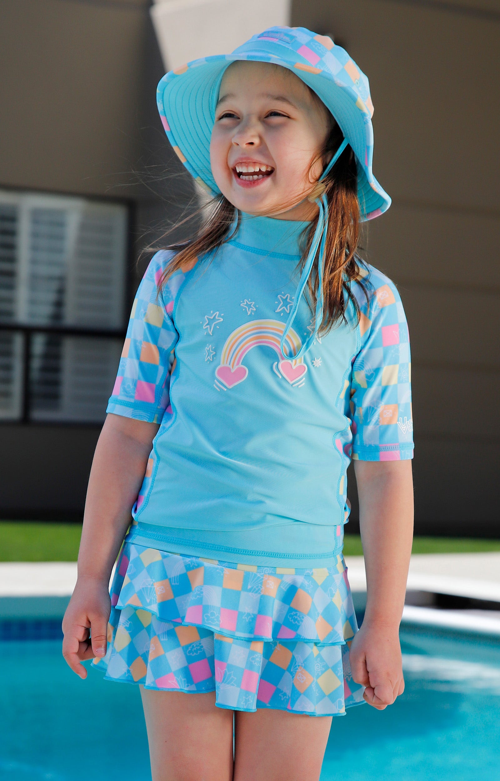 girl by pool in girls swim hat|treasure-checkers