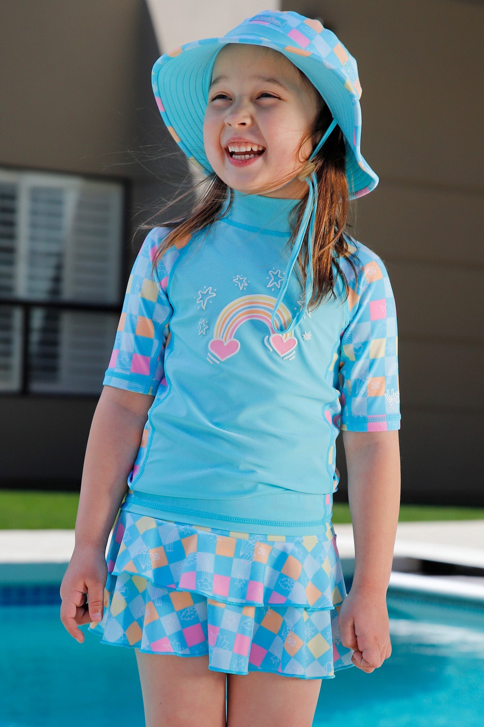 girl laughing by pool in girls sunny swim skirt|treasure-checkers