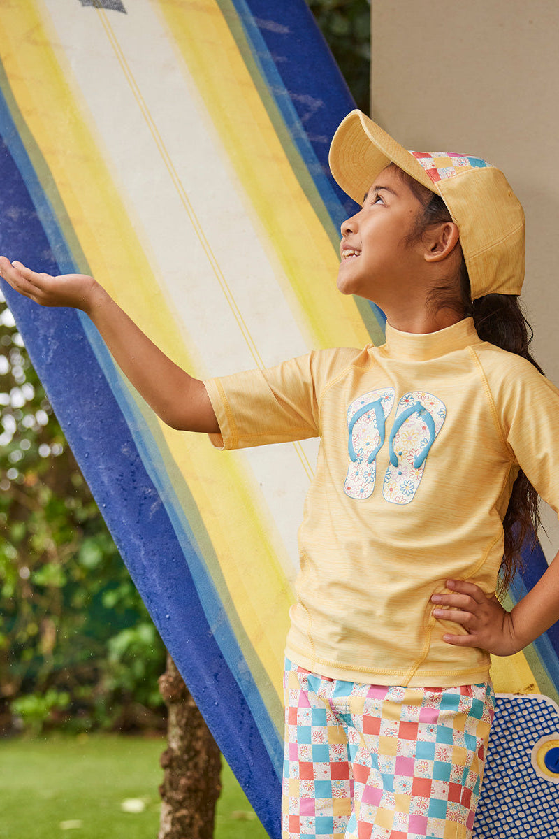 girl in snap back hat|marigold-checkered-daisies
