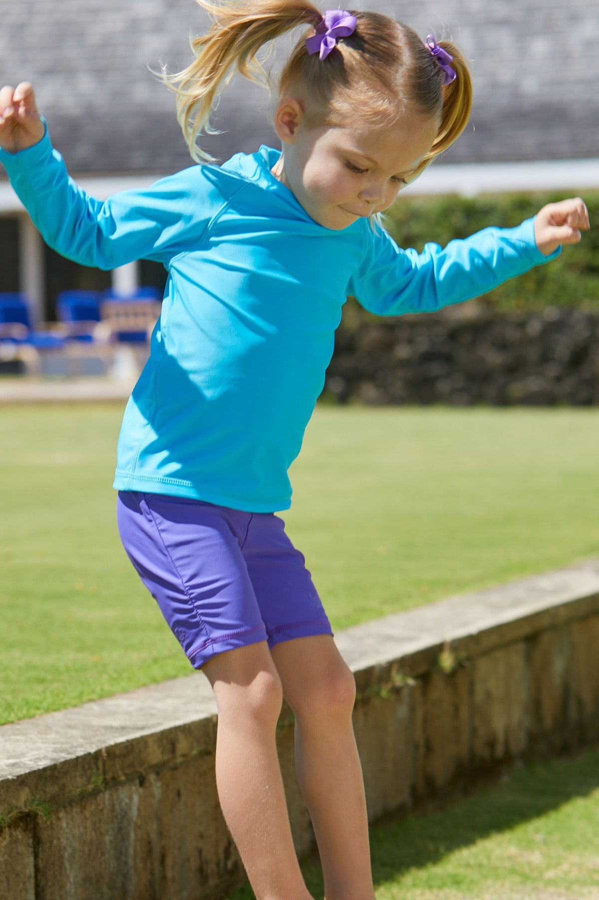 Little girl in the kid's long sleeve swim shirt in aqua|aqua